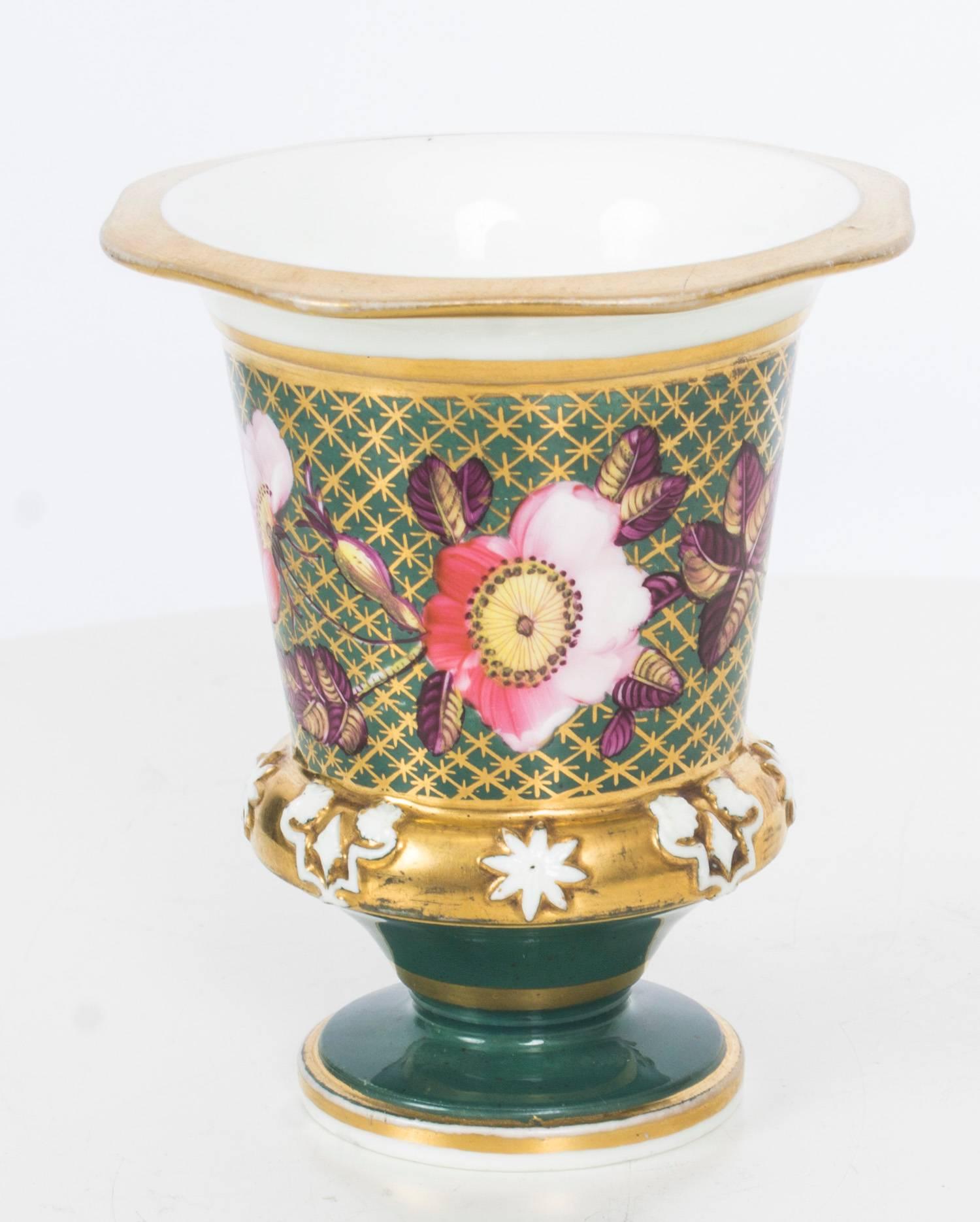 This is a truly superb pair of hand painted English Regency porcelain beaker matchpots or spill vases, circa 1820 in date.

Beautifully hand-painted with flowers on a green ground with exquisite gilded decoration, one with gilt pattern number 922