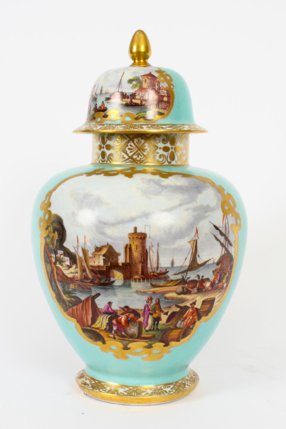 This is a beautiful antique pair of Helena Wolfsohn Dresden porcelain vases and covers, circa 1850 in date.

Each ovoid shaped vase features painted panels of figures in Kauffahrtei scenes on a sea green ground highlighted in gilt. The bases