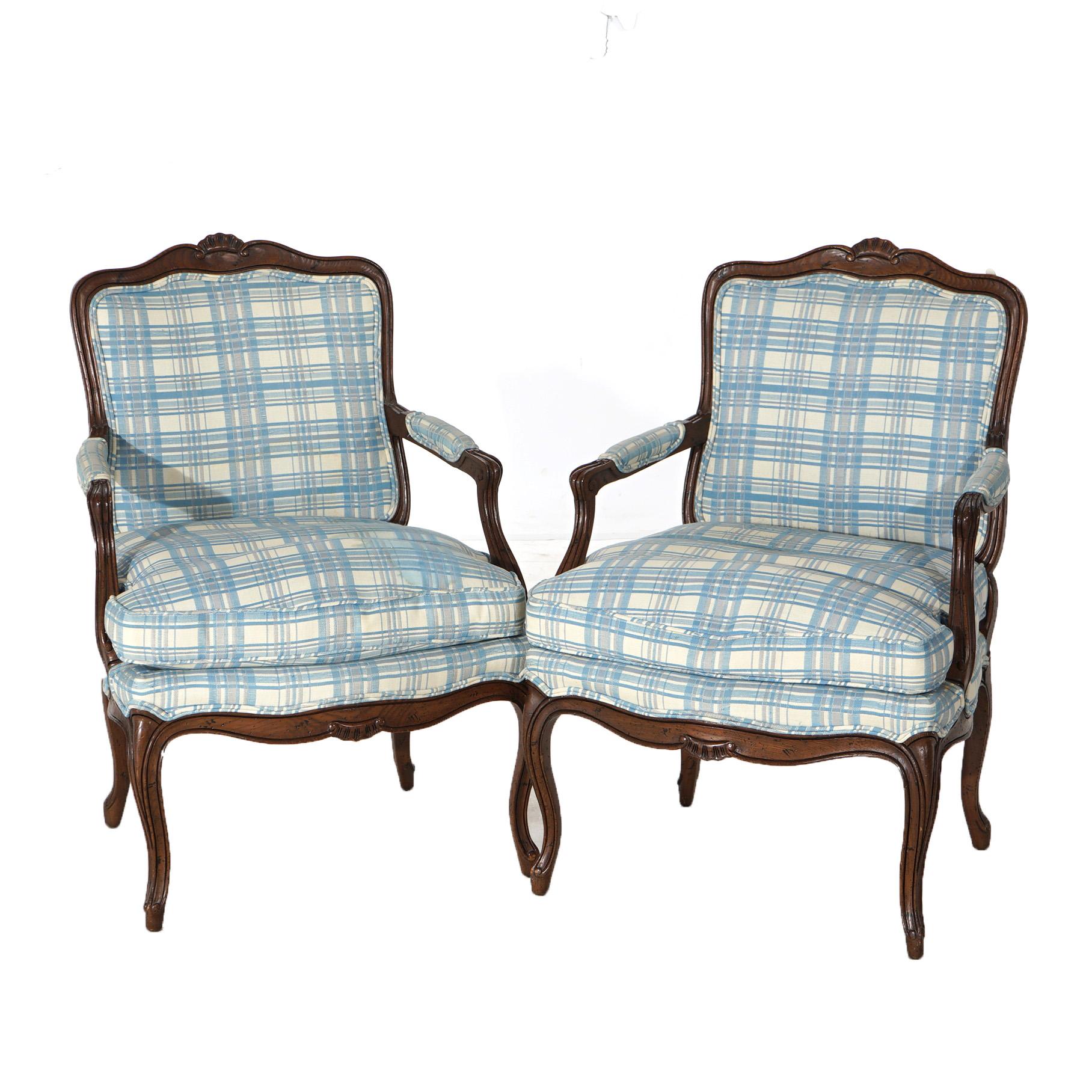 ***Ask About Lower In-House Shipping Rates - Reliable Service & Fully Insured***
A pair of arm chairs by Henredon offer mahogany frames with shaped rail having central carved gadroon element over upholstered back and seat, raised on cabriole legs,
