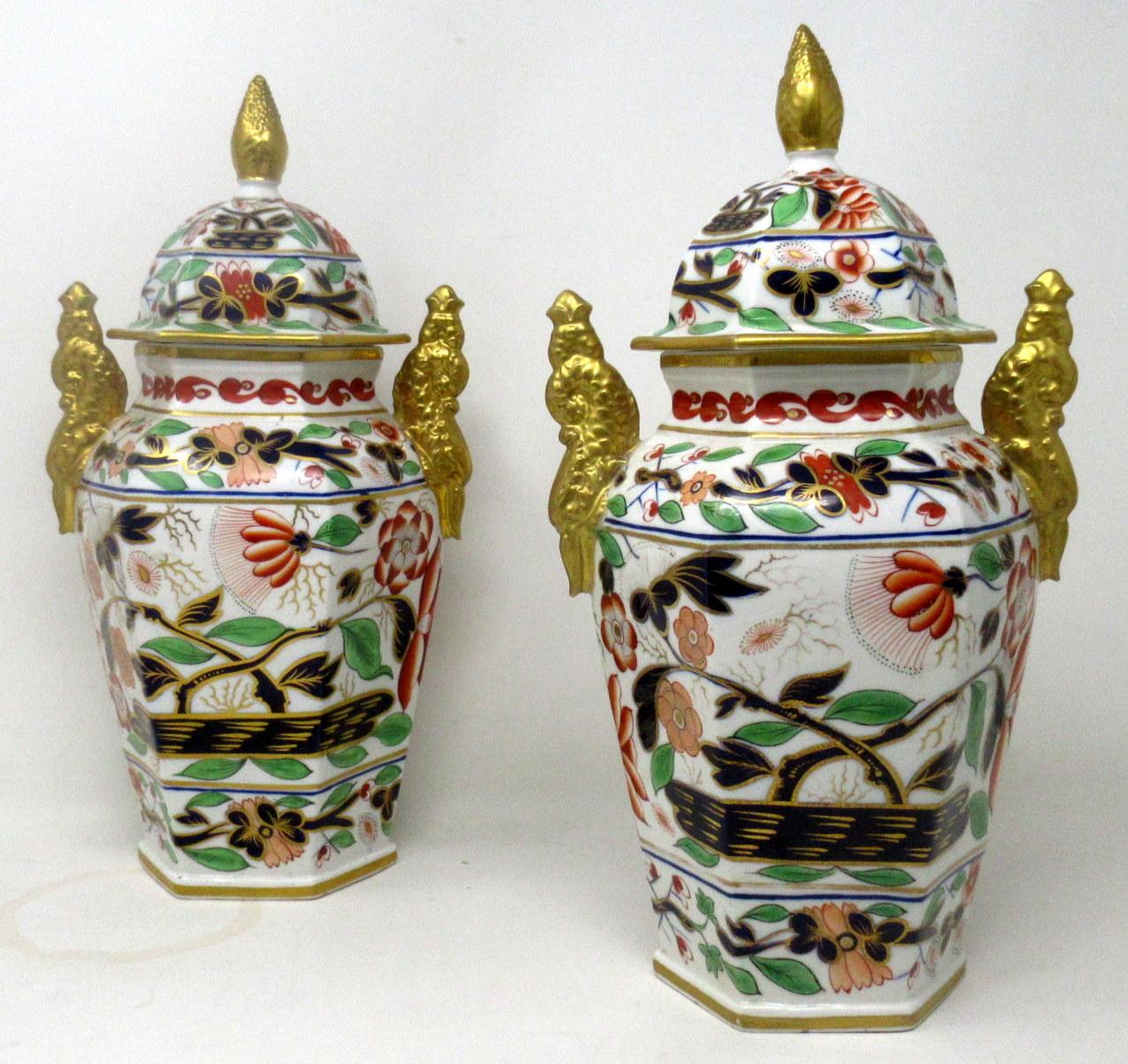 An Imposing identical Pair of English Chamberlains Worcester Porcelain Vases of hexagon outline and generous proportions, complete with their original firm fitting covers. Circa last quarter of the Nineteenth Century. 

The main outer bodies