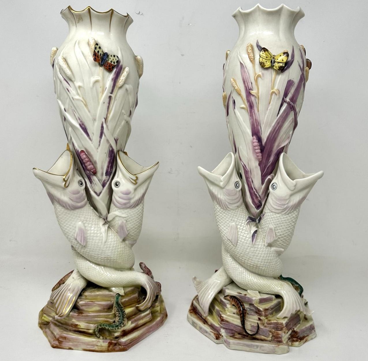 An extremely rare Pair of Irish Belleek Porcelain Victorian “Triple Fish Vases” of Museum quality and very large proportions. First period black mark for 1863 to 1890.  

Each baluster formed vase with waisted fluted decorative rim is raised on