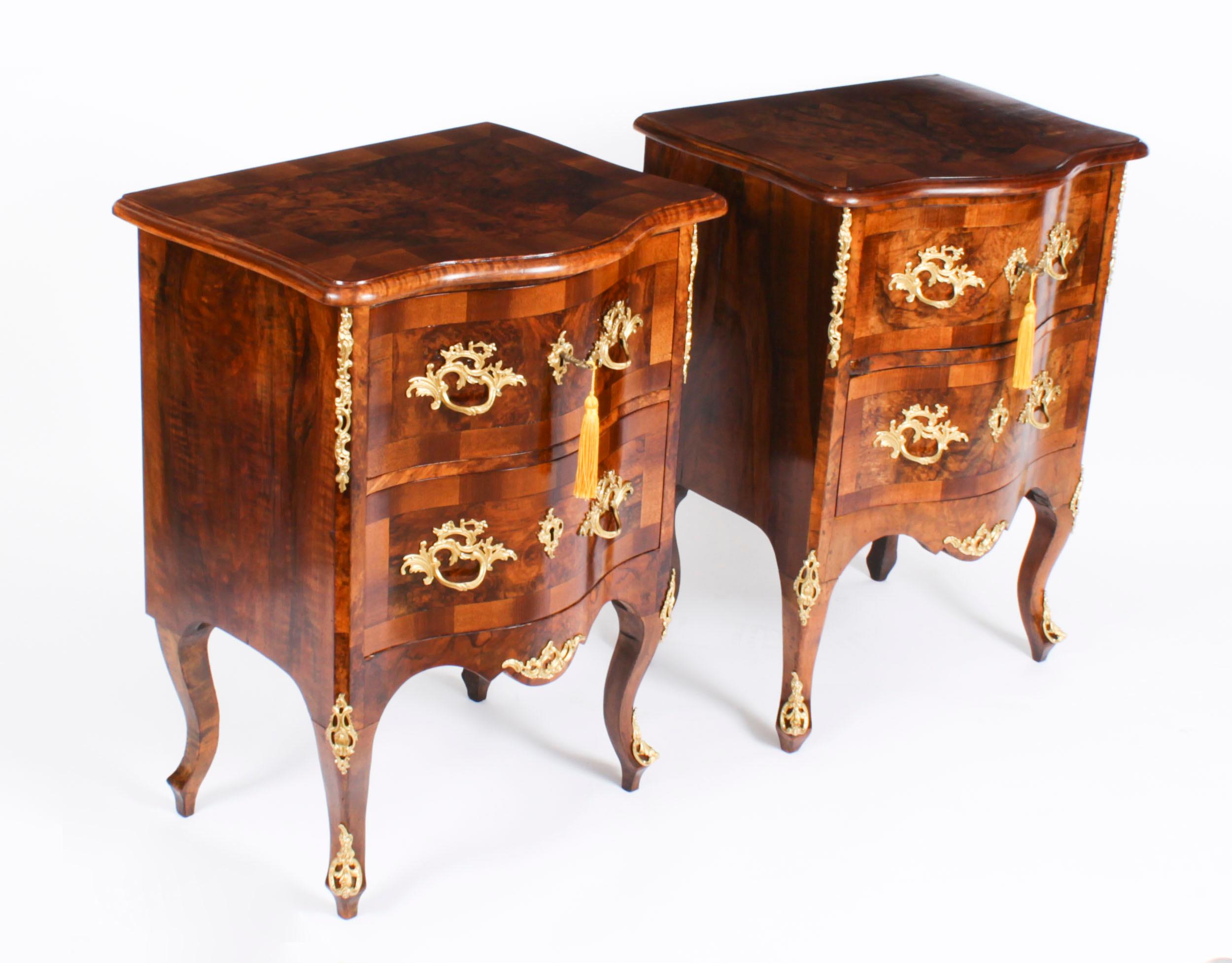 This is a stunning pair of Antique Italian burr walnut and ormolu mounted serpentine fronted Petite Commodes, or bedside chests, circa 1830 in date.
 
 They are crafted from the most beautiful burr walnut with decorative gilded ormolu mounts and