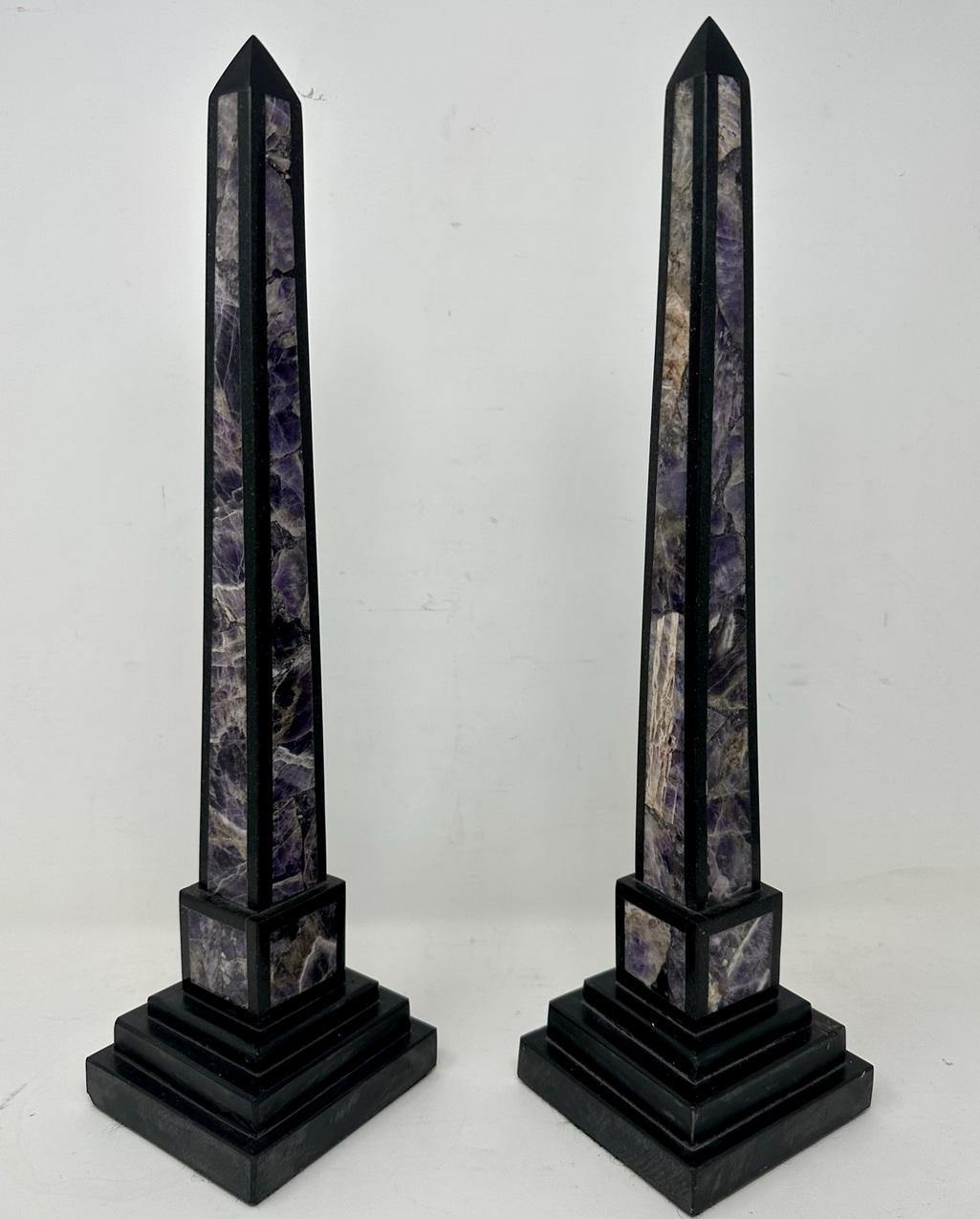 Magnificent and rare Pair of Italian Grand Tour style Petra Dura Classical Marble Obelisks of tall slender proportions, late Nineteenth, early Twentieth Century.  

The tall slender column of black marble inlaid on all four sides with either Quartz