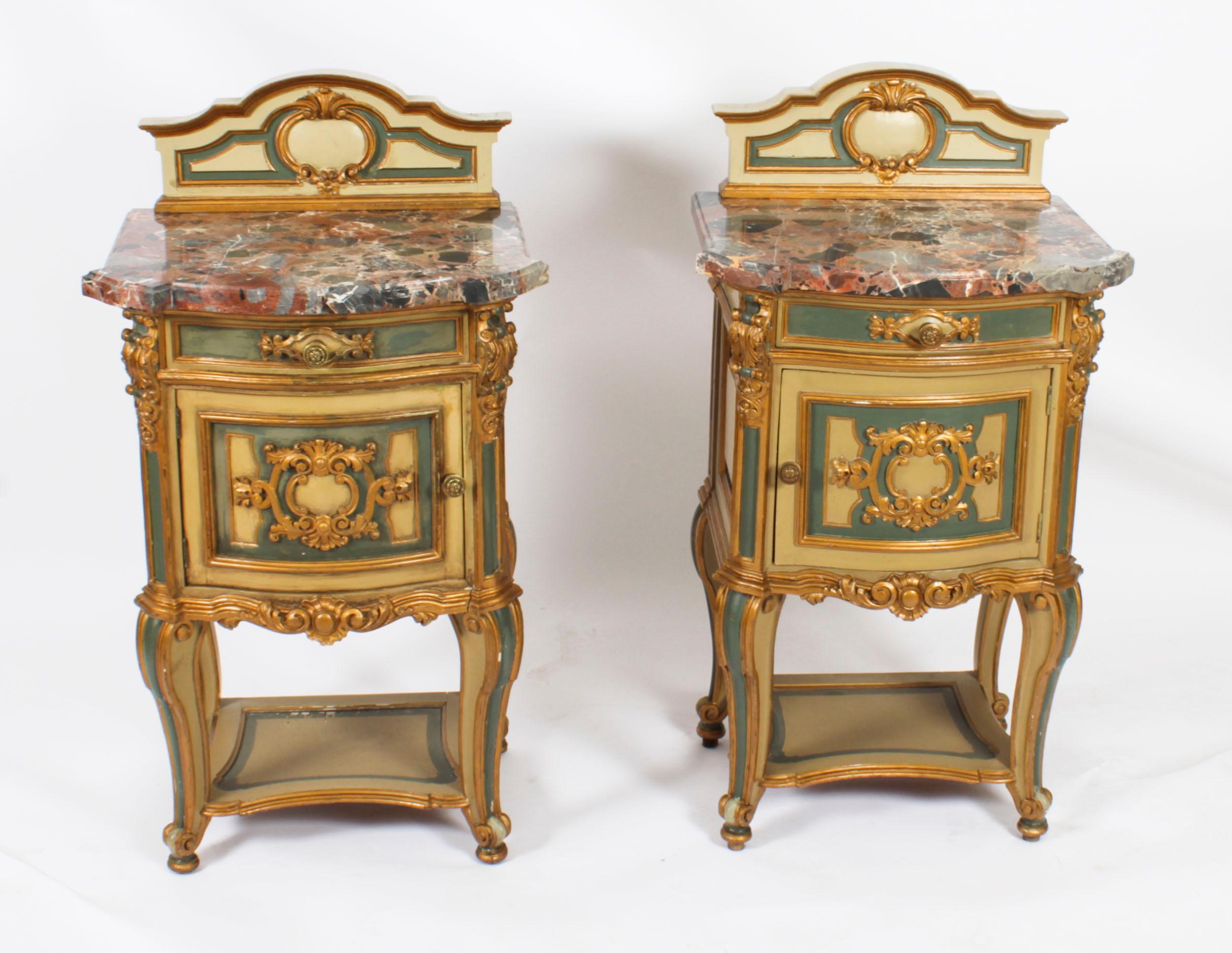 A thoroughly delightful pair of antique Italian cream azure and gold painted, marble topped bedside cabinets, circa 1900 in date.
 
They each have shaped mottled Rouge de Rance marble tops, shaped stage backs and a drawer above a cupboard. They