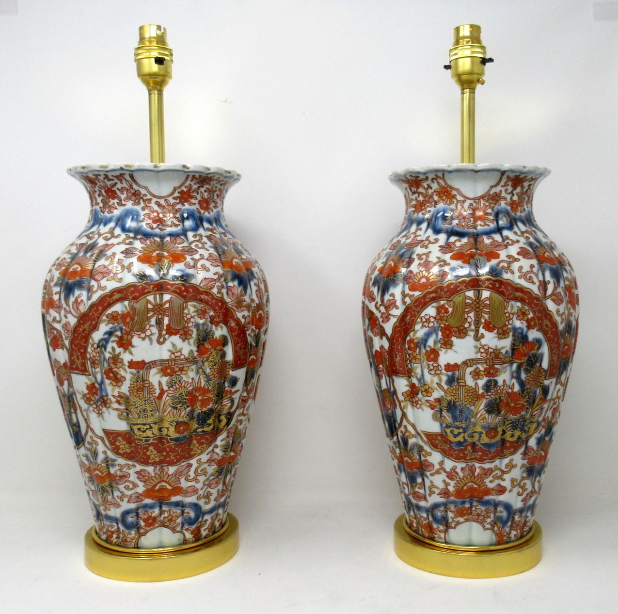 Stunning pair traditional Japanese Imari bulbous form Porcelain vases of generous proportions, now converted to a pair of electric Table Lamps, complete with ormolu stepped circular bases and later ormolu mounts. First half of the Nineteenth