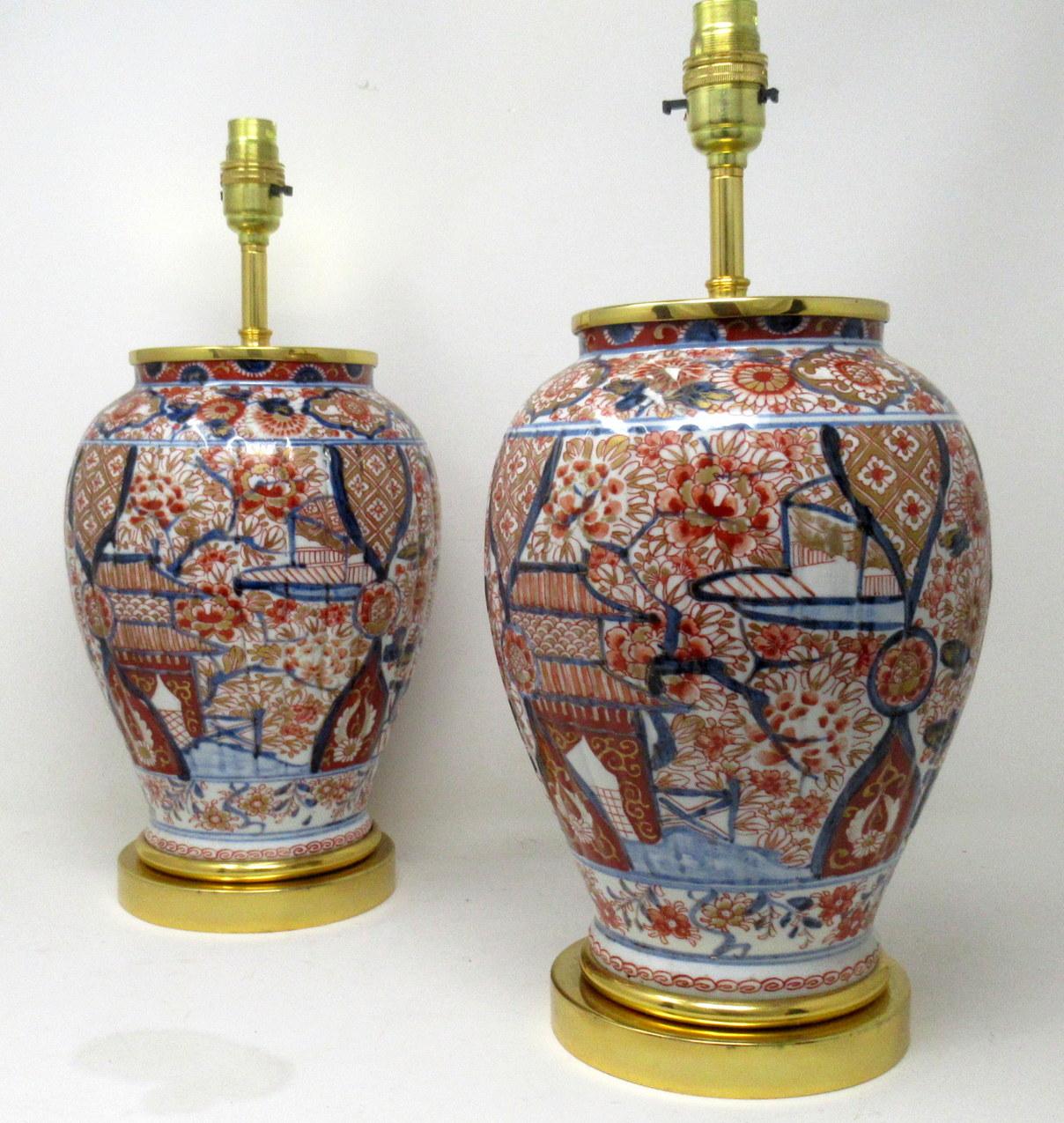 Stunning Pair Traditional Japanese Imari Bulbous Form Porcelain Vases of generous proportions, now converted to a pair of electric Table Lamps, complete with ormolu stepped circular bases and later ormolu mounts. First half of the Nineteenth