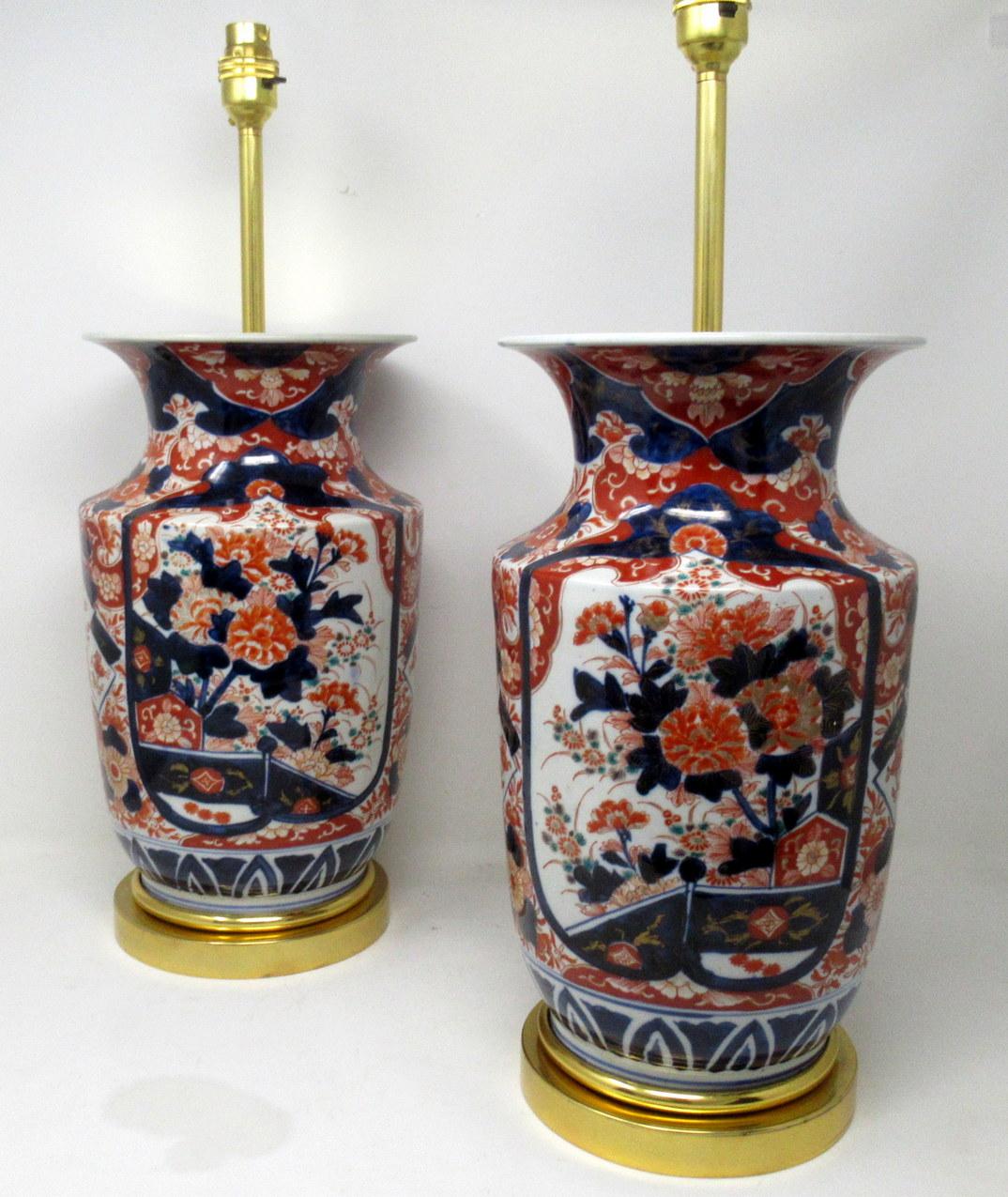 Stunning Pair Traditional Japanese Imari Porcelain Vases of traditional urn form with flair rims and of very substantial proportions (see last image in situ) now converted to a pair of electric Table Lamps, complete with ormolu stepped circular