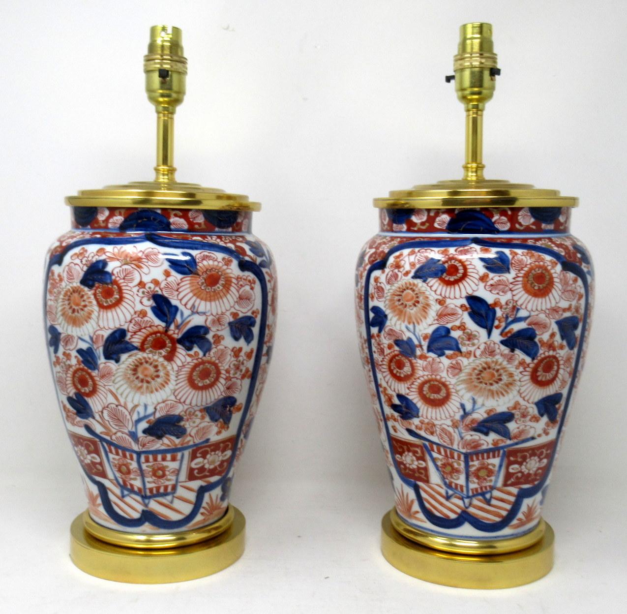 Stunning pair traditional Japanese Imari Bulbous form porcelain vases of generous proportions, now converted to a pair of electric Table Lamps, complete with ormolu heavy gauge stepped circular bases and later ormolu mounts. First half of the