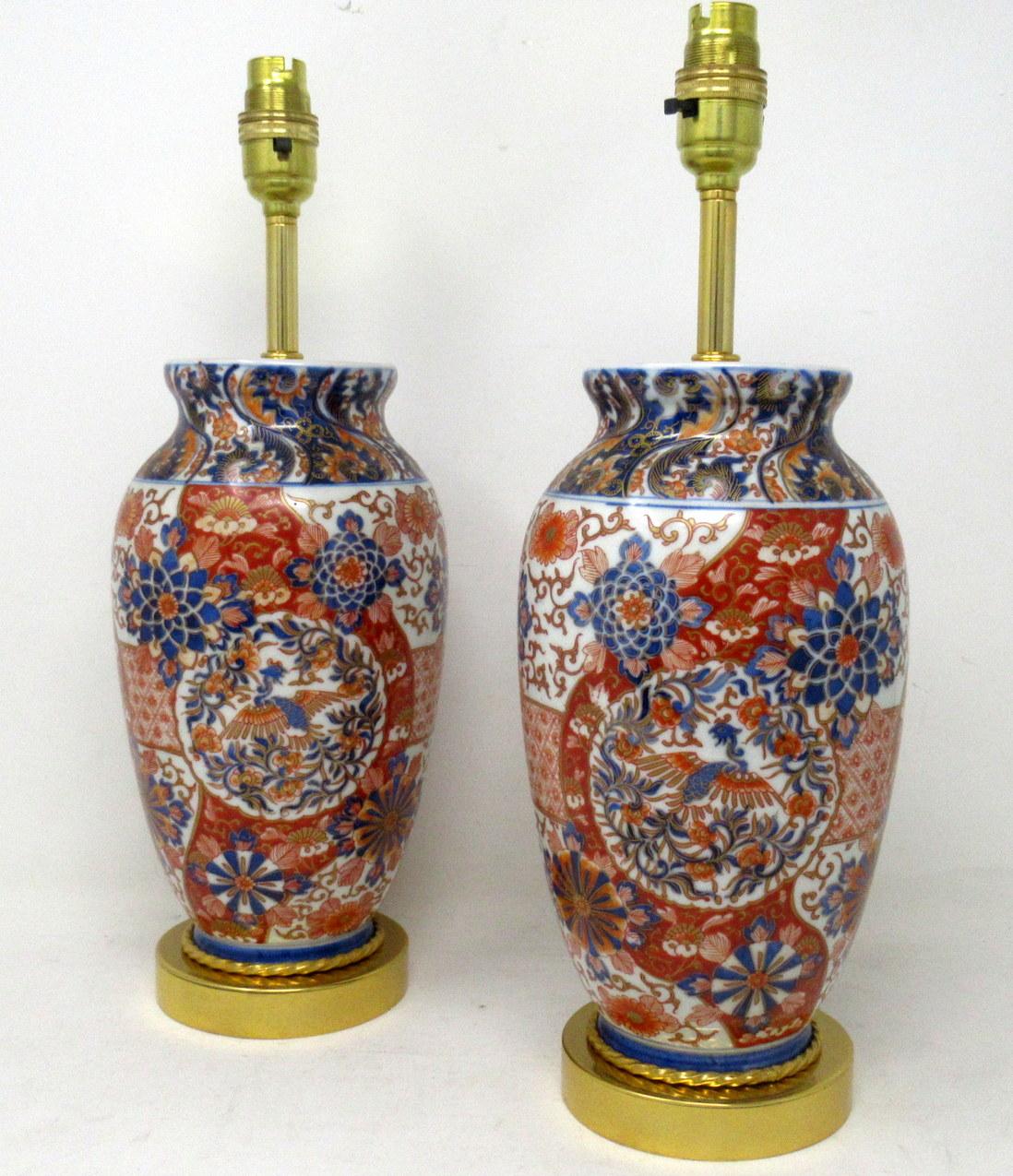 Stunning Pair Traditional Japanese Imari Bulbous Form Porcelain Vases of medium proportions, now converted to a pair of electric Table Lamps, complete with ormolu heavy gauge stepped circular bases and later ormolu mounts. Second half of the