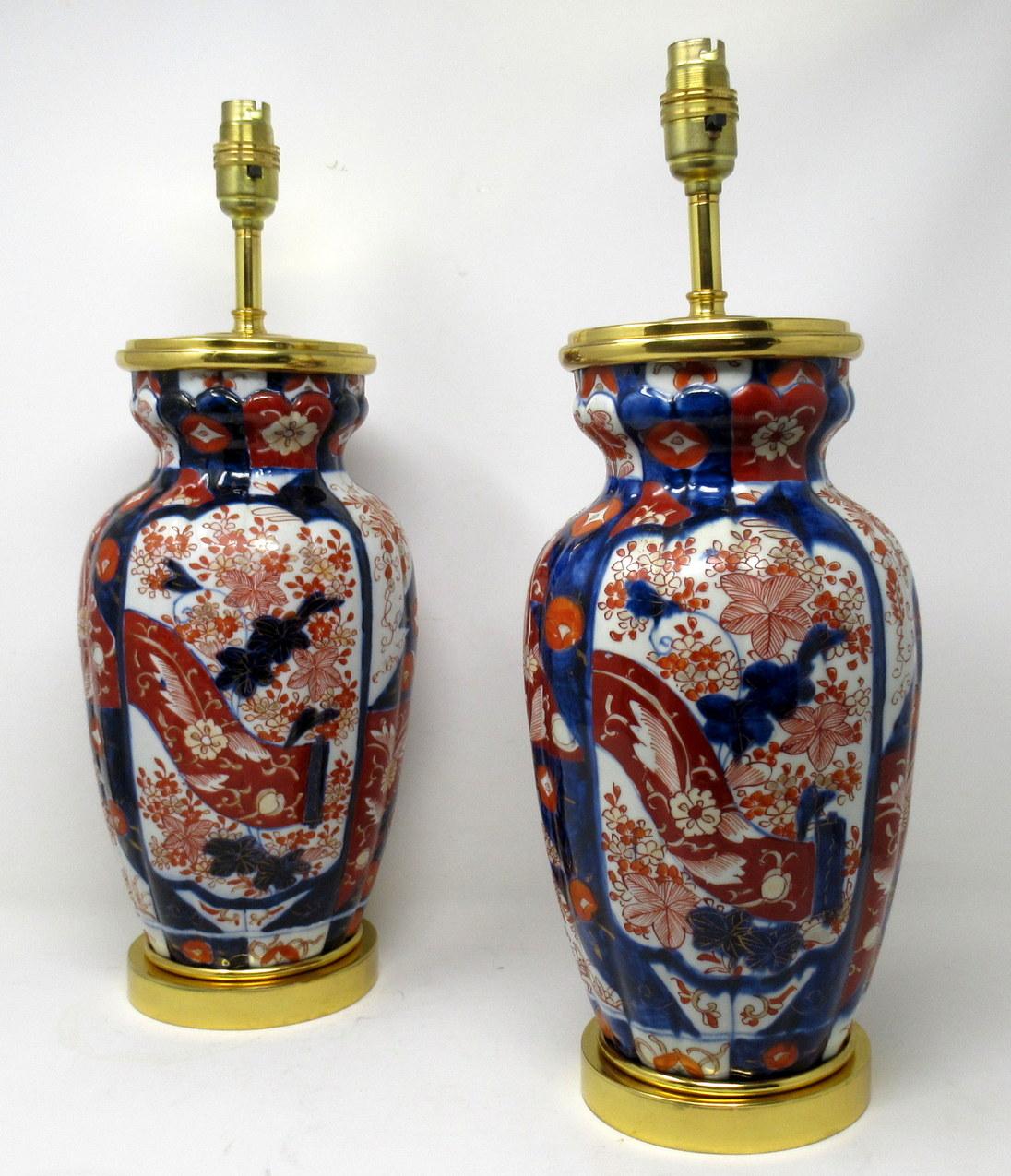 Stunning Pair Traditional Japanese Imari Bulbous Form Porcelain Vases of medium to large proportions, now converted to a pair of electric Table Lamps, complete with ormolu stepped circular bases and later ormolu mounts. First half of the Nineteenth