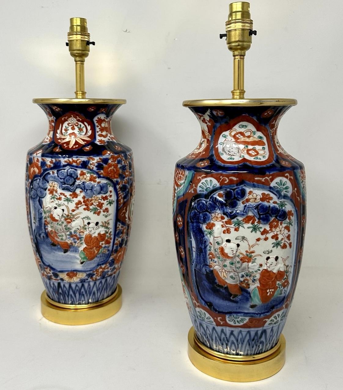 Stunning Pair Traditional Japanese Imari Bulbous Form Porcelain Vases of medium to large proportions, now converted to a pair of electric Table Lamps, complete with ormolu stepped circular bases and later ormolu mounts. Second half of the Nineteenth