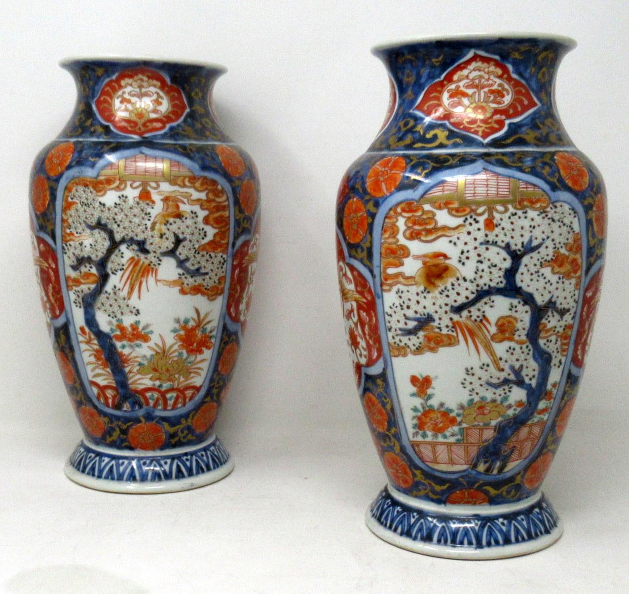 Stunning Pair Traditional Japanese Imari Bulbous Form Hand Painted Porcelain Vases of quite large proportions. Second half of the Nineteenth Century. 

The main outer porcelain body with stylish flared rims and ovoid tapering form, plain glazed