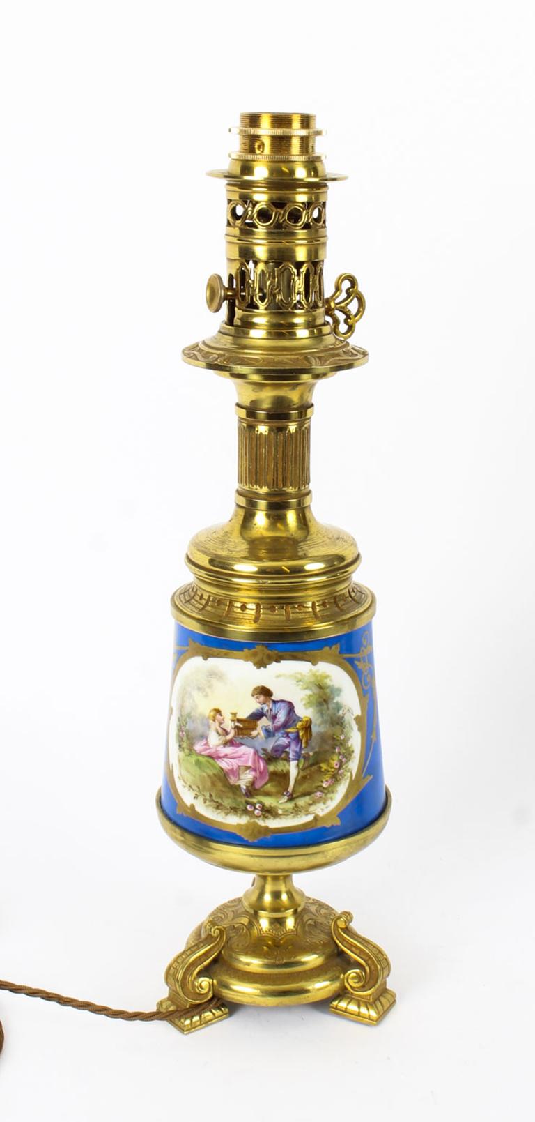 This is an exquisite large pair of French Sèvres Porcelain and ormolu mounted oil burning table lamps that have been skillfully converted to electricity retaining their original and charming oil burning mounts, circa 1870 in date.

The lamps have