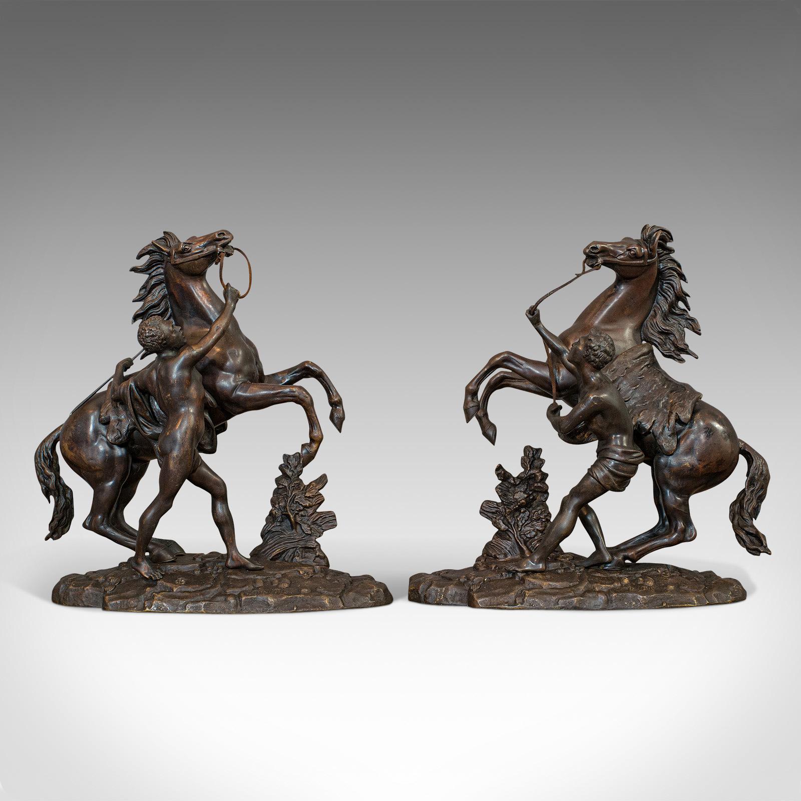 This is an antique pair of Marly horses. A French, bronze equestrian statue after Guillaume Coustou (1677-1746), dating to the late 19th century, circa 1900.

Beguiling representations of the famous Marly marble horses - now in the Louvre
Each