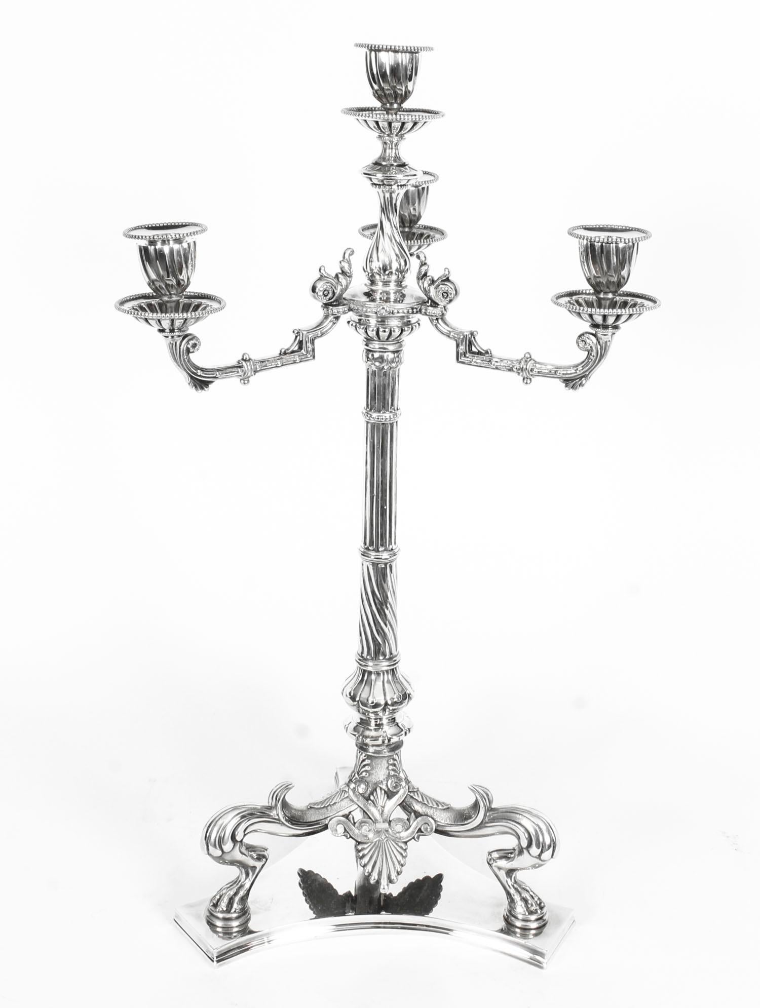 This is a truly magnificent and highly distinguished pair of antique Victorian silver plated four-light three-branch table candelabra by the renowned silversmiths Hodd & Linley, Hatton Gardens, London, circa 1870 in date.

Each of these splendid