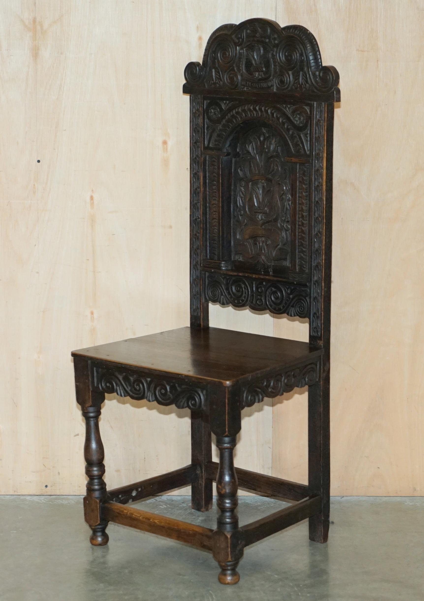 Royal House Antiques is delighted to offer for sale this exquisite pair of 17th century English oak hall or side chairs that were used in the 2004 film Hellboy and that have carved in the top back 