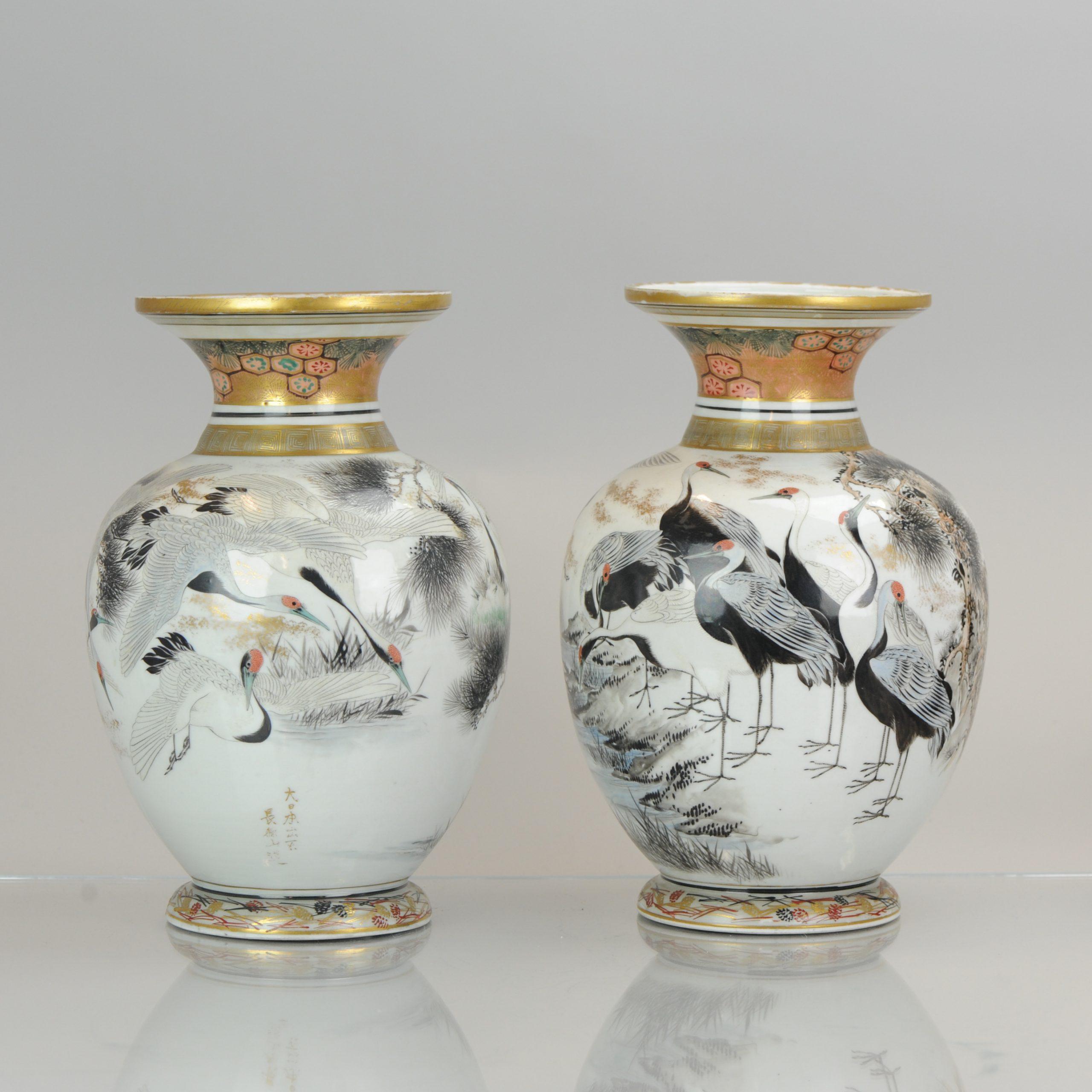 Fabulous Japanese vases. A pair of very nice 19th century porcelain vases in Satsuma style. I think they are actually Kutani but the rim decoration is very much a reference to Satsuma ware. They are both fully decorated with cranes, not mirroring