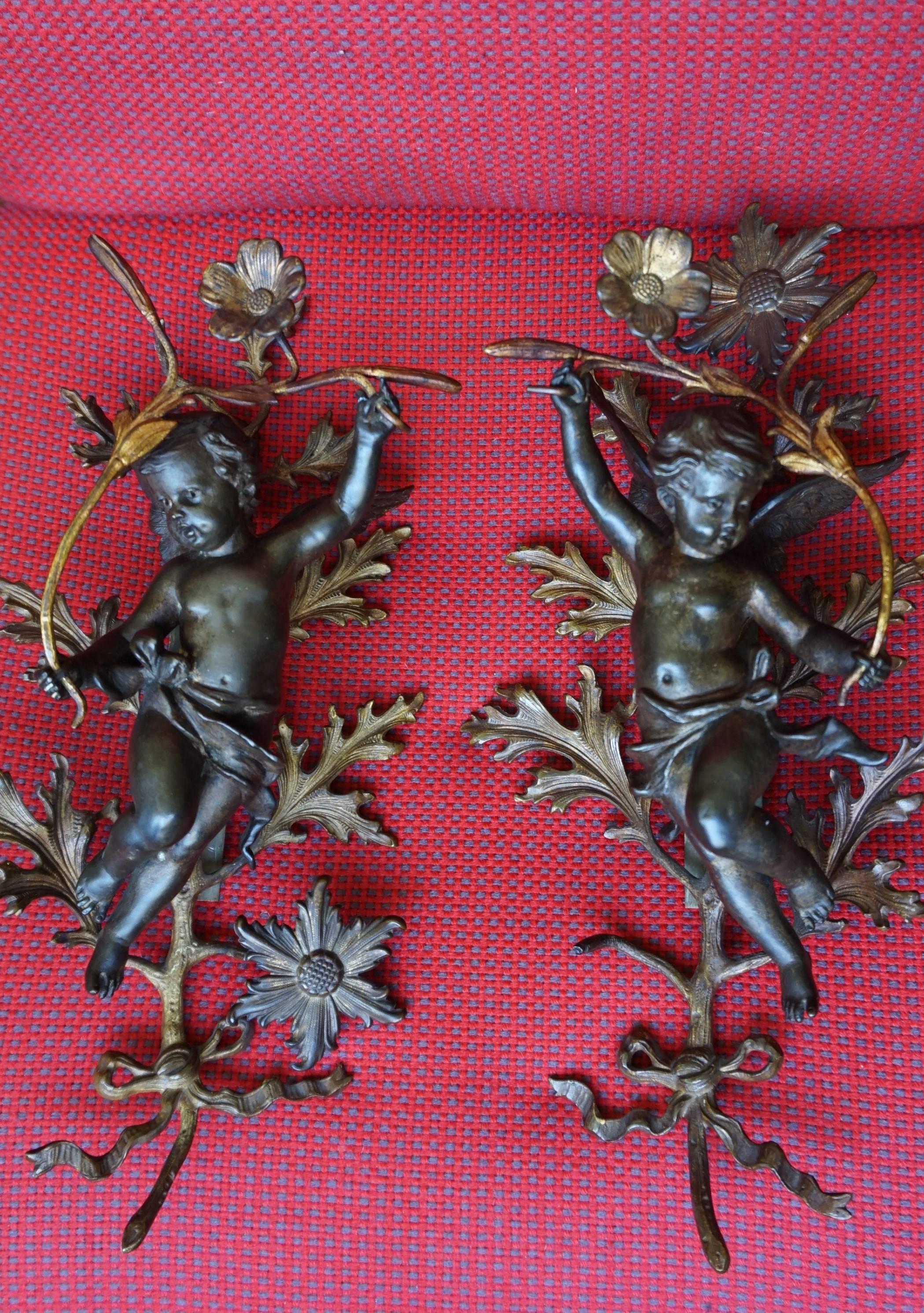 Very fine quality and highly decorative angel sculptures for wall mounting.

These Baroque Revival, metal putti sculptures have the most beautiful patina and the details of these little boy angels are truly beautiful. The artist must have studied