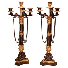Paire de chandeliers anciens du 19e siècle en bronze et bronze doré