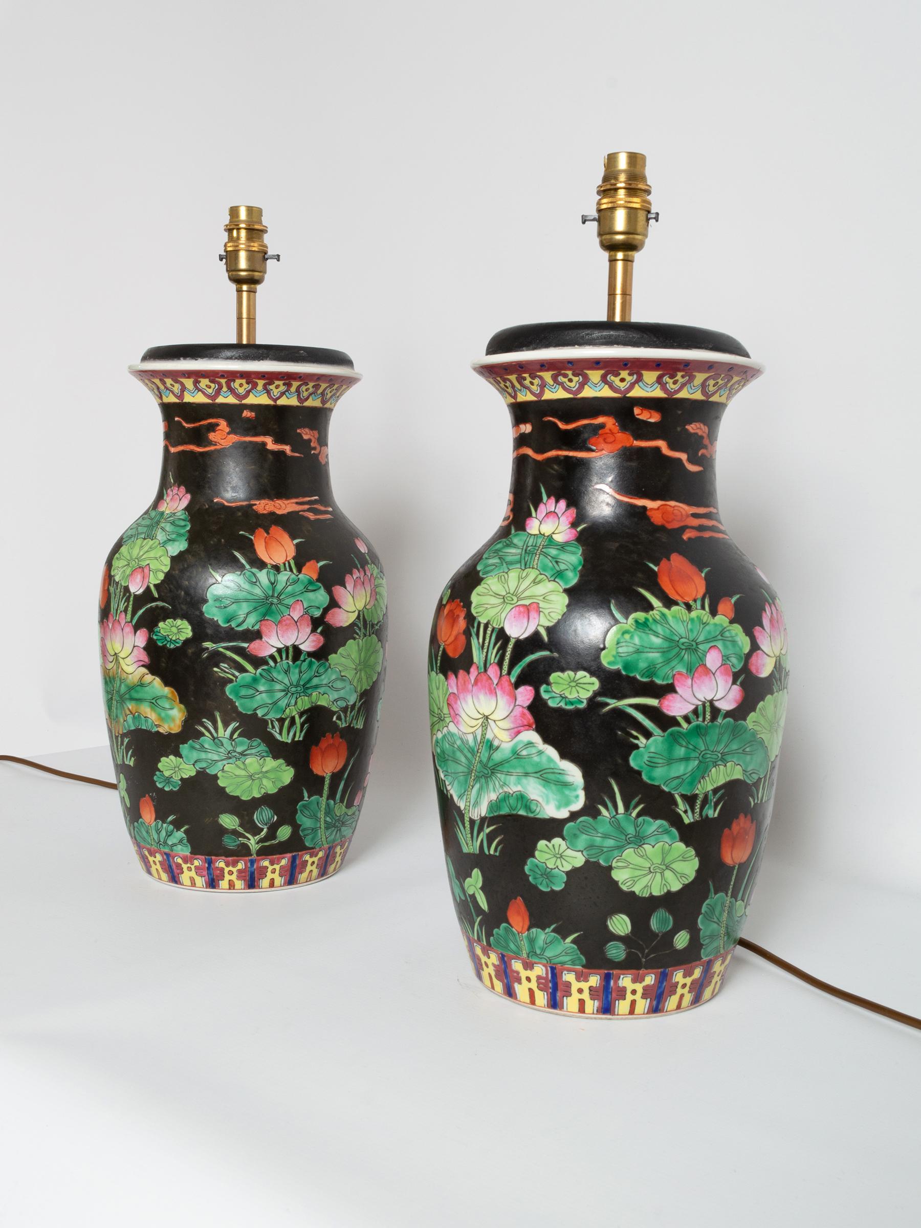 A pair of 19th century Chinese Famille Noire baluster vase lamps.
Beautifully hand painted.
In very good original condition. Wear consistent with age and use. Some loss to the glaze of one vase lamp.

Shades for illustrative purposes only.
  