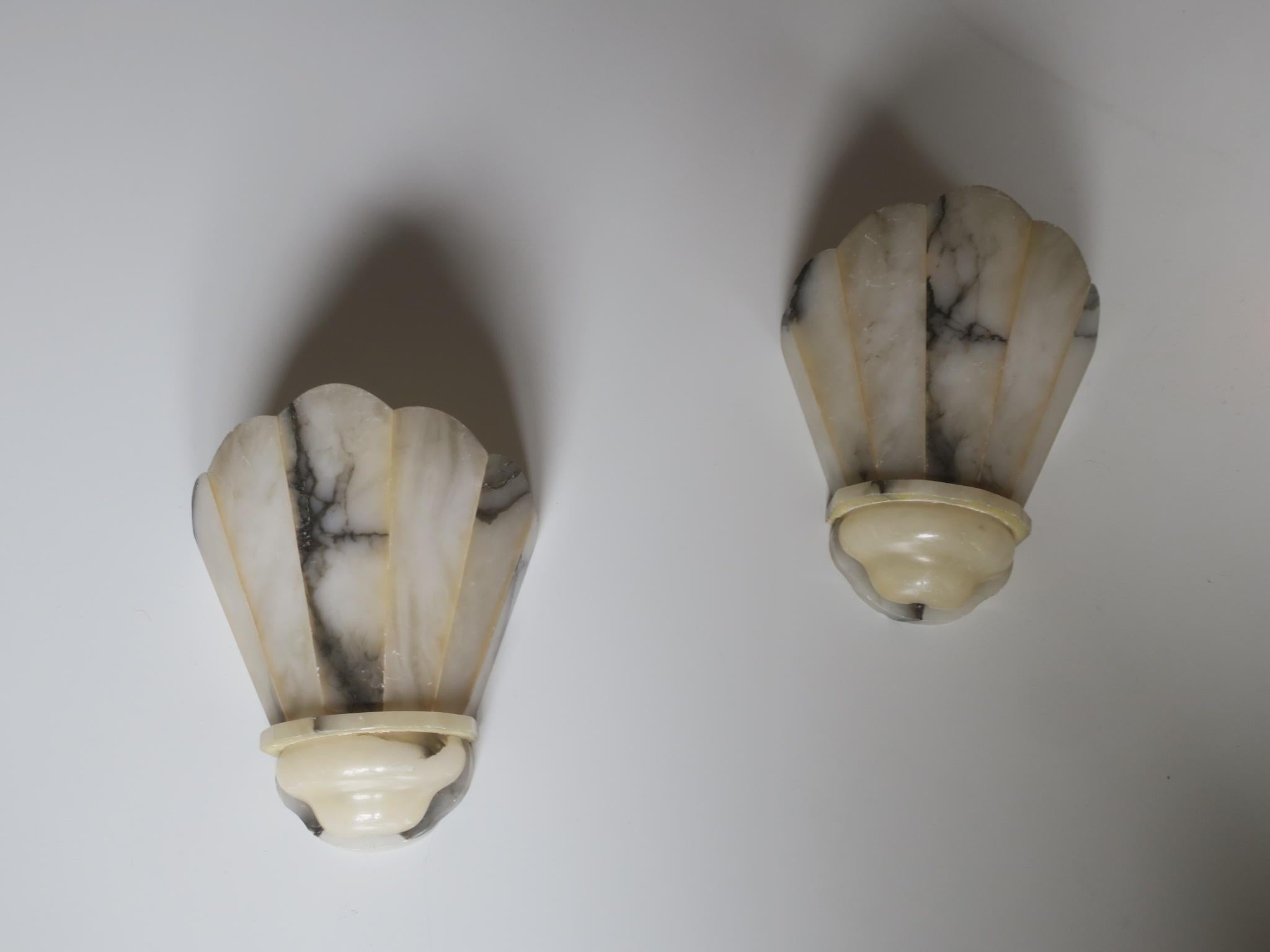Pair of alabaster art deco sconces dating from the 1920s, clear form and beautifully veined.