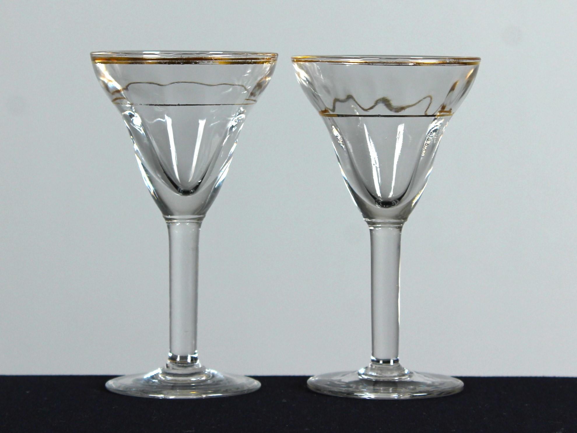A beautiful set of two antique wine glasses with decorative golden design.

In 19th century France, the art of glassmaking experienced a renaissance inspired by the rich history and heritage of ancient techniques. Antique glasses from this era are