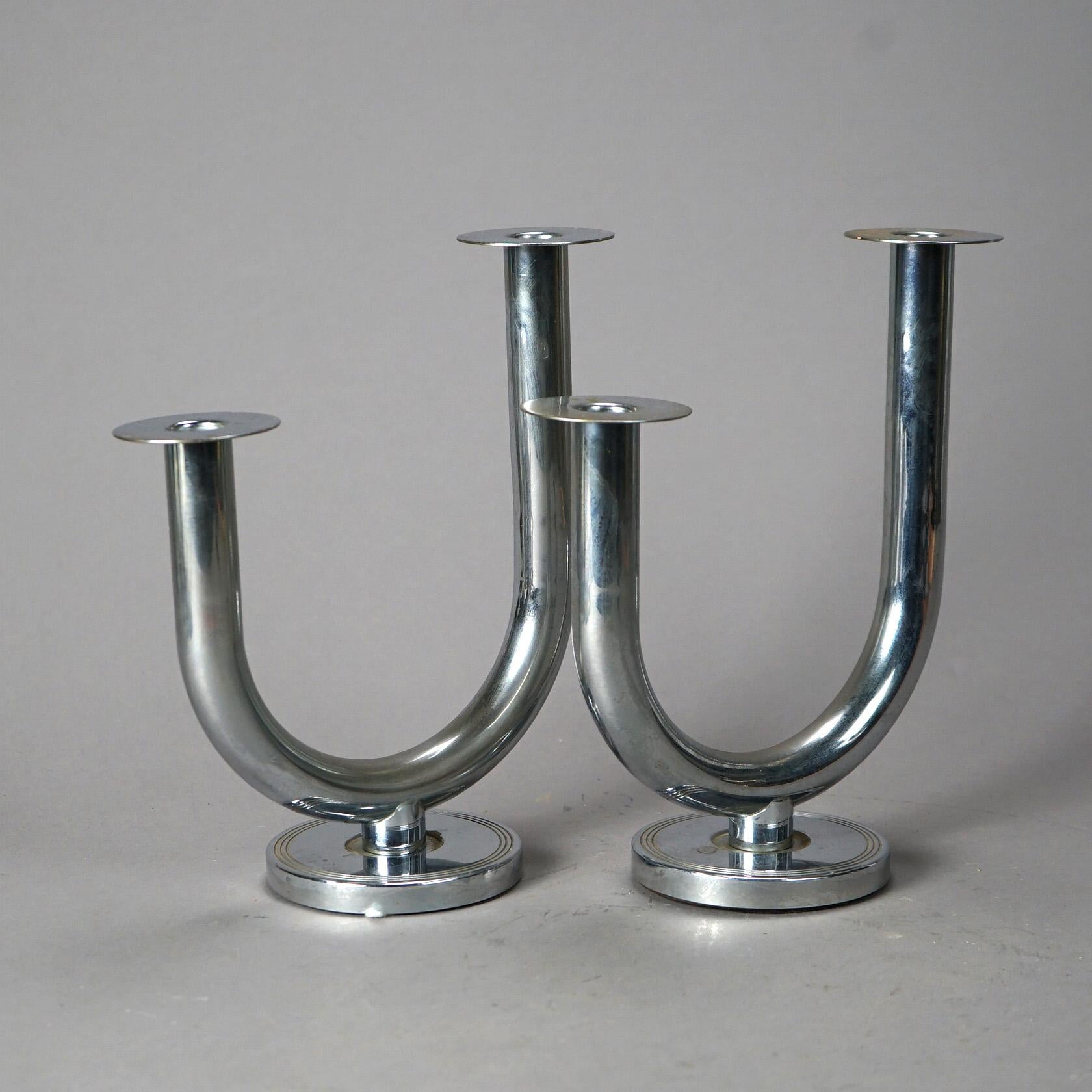 An antique pair of Art Deco double candlesticks offer chrome construction in stylized u-form, c1930

Measures - 10