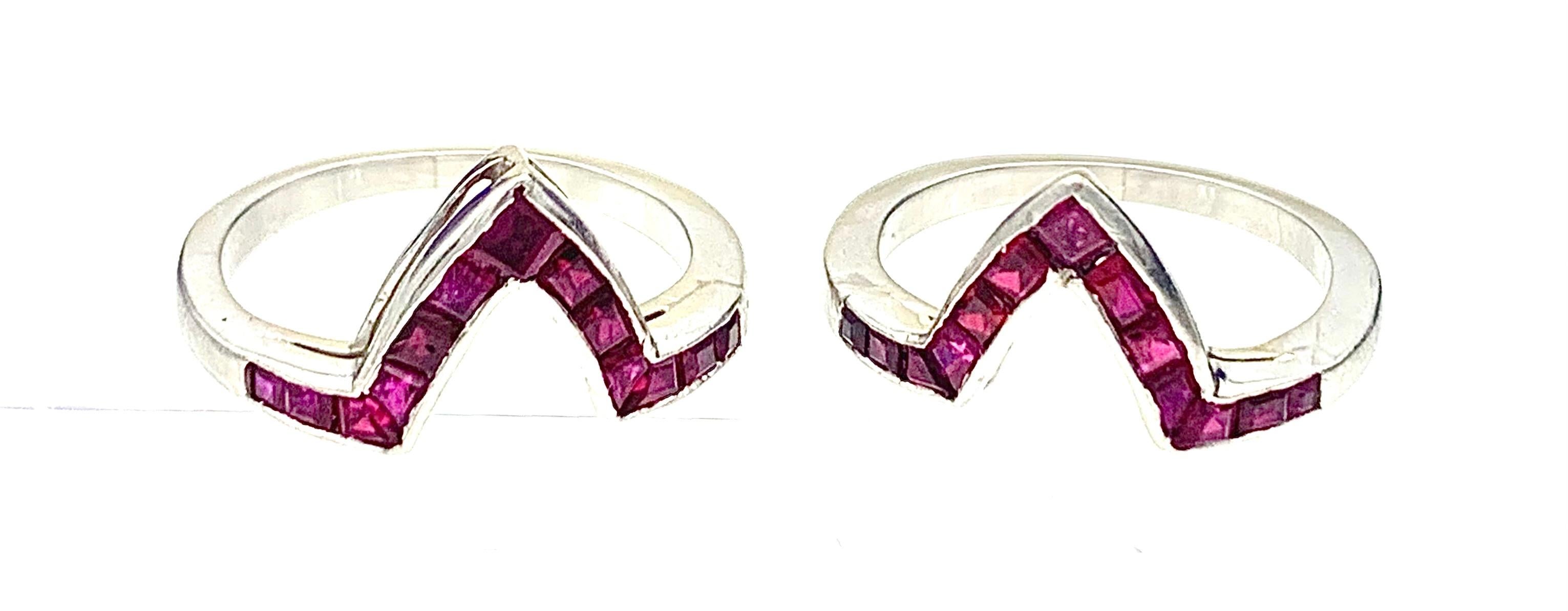 This unusual pair ruby and platinum rings was made in 1920ca. Each ring is made out of platinum and set with rectangular and square calibré cut rubies.  The rings can be worn as a pair, depending which way they are worn there are two different