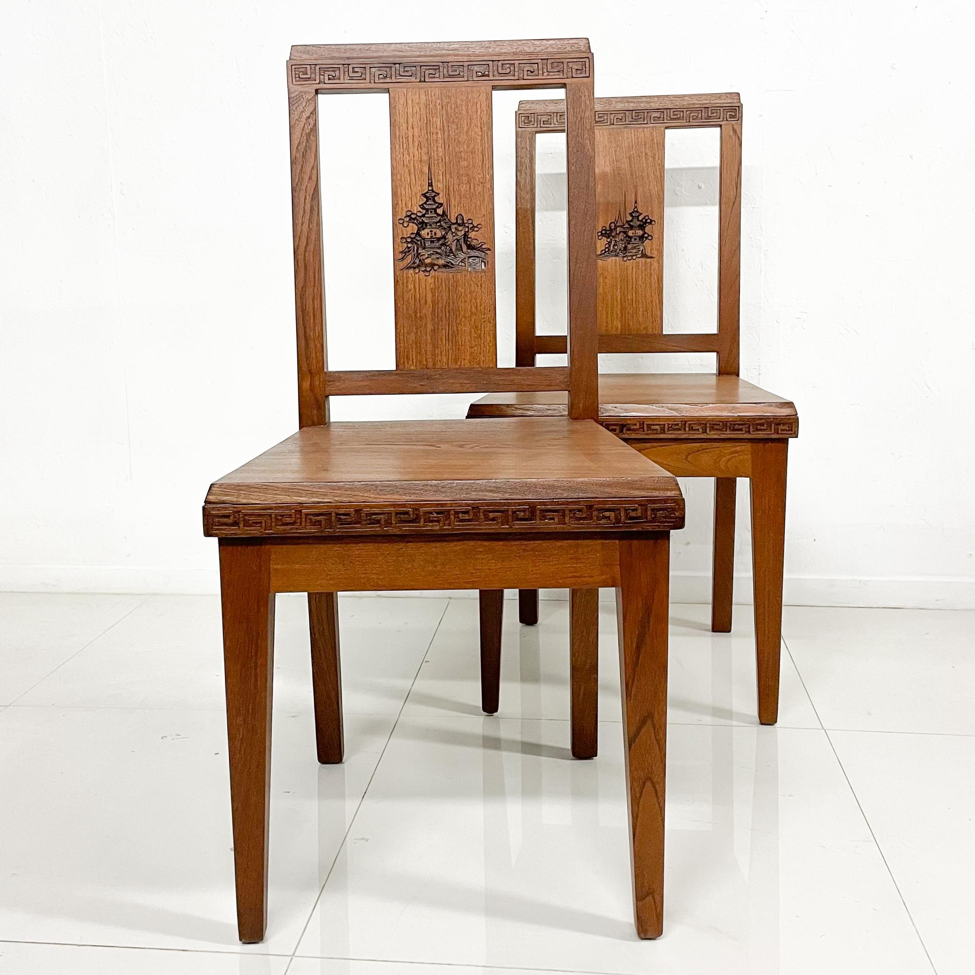 Carved Chairs
Fabulous Collectible Antique Pair of Asian Art Carved Wood Side Chairs made in Hong Kong, 1940s
Original brass label present. Wah On Hung Kee Co 18 Queen's Road East Hong Kong a pioneer company of the wooden furniture industry in Hong