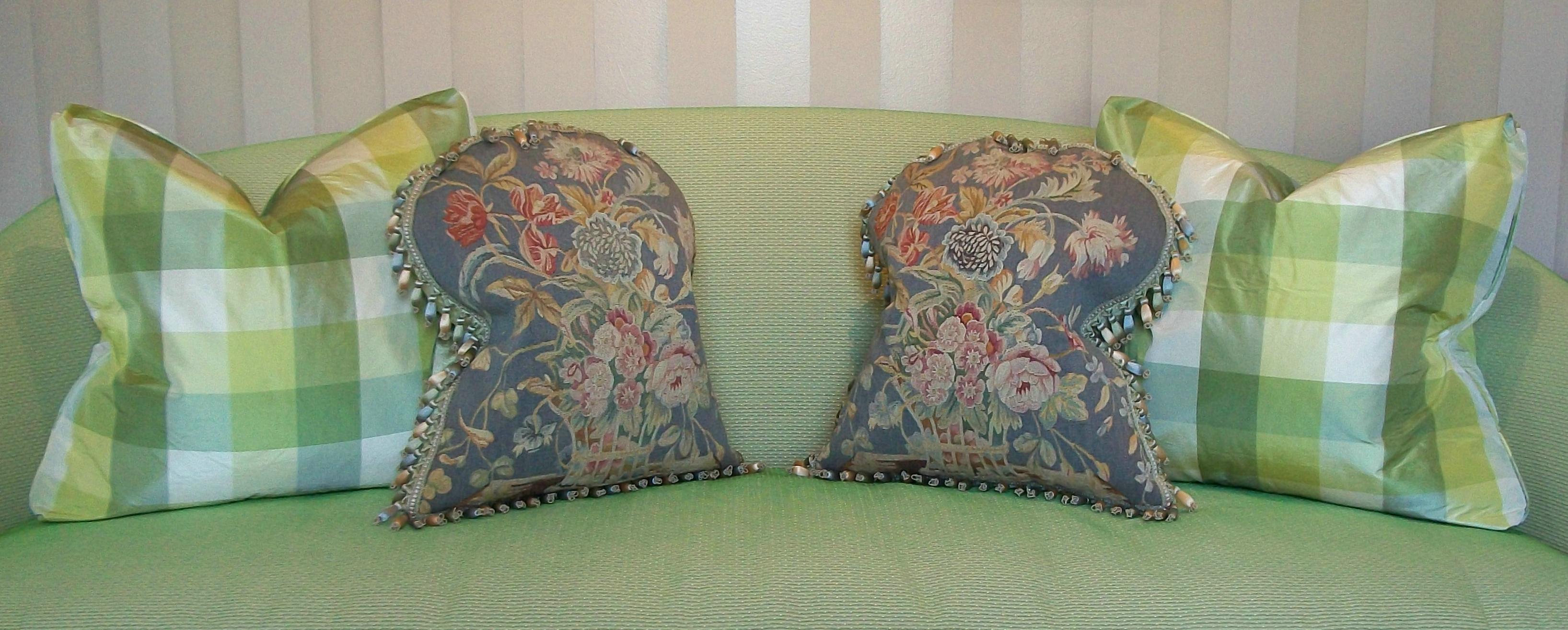 Antique pair of Aubusson tapestry pillows - featuring baskets filled with flowers to each pillow front - hand woven with silk threads for the flowers, leaves and stems - set against a gray wool background - the tapestries framed by hand sewn French