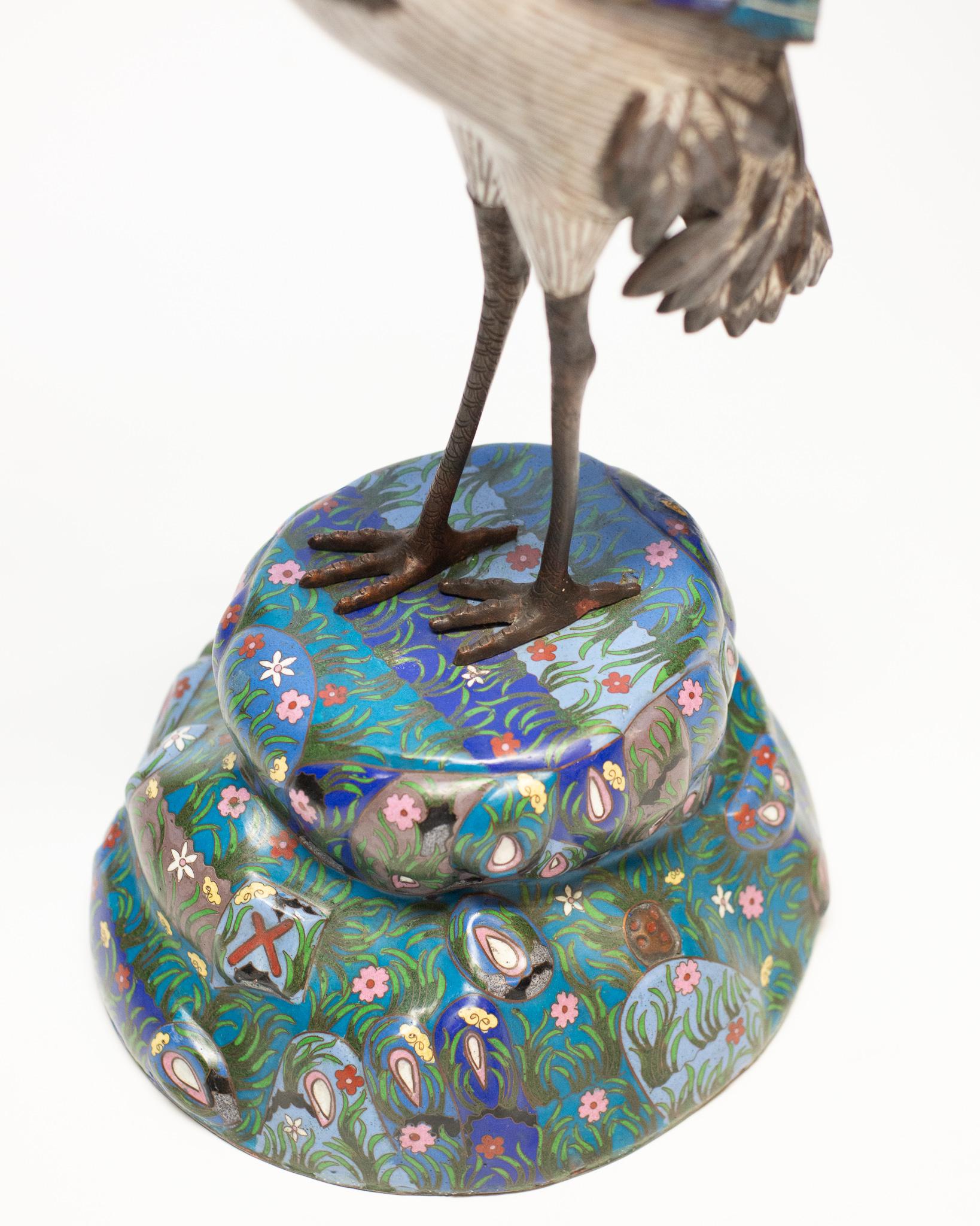 This fine pair of antique Cloisonné cranes would look equally good on a console or acrylic stand and would add presence to any room. Cloisonné, derived from the French word “enclosed” is an ancient technique of decorating metalwork objects. This