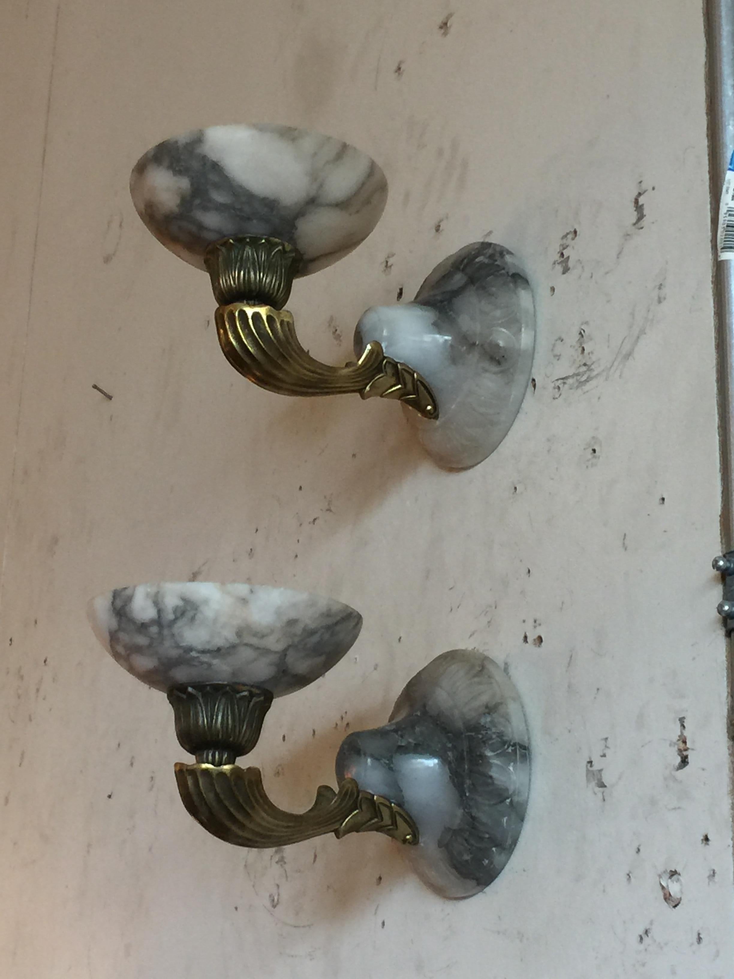 These lovely sconces just didn't work in our bathroom. That is actually where we photographed them at first. We also had held one and we put the 2 on the wall of the shop to get the best look I believe.
