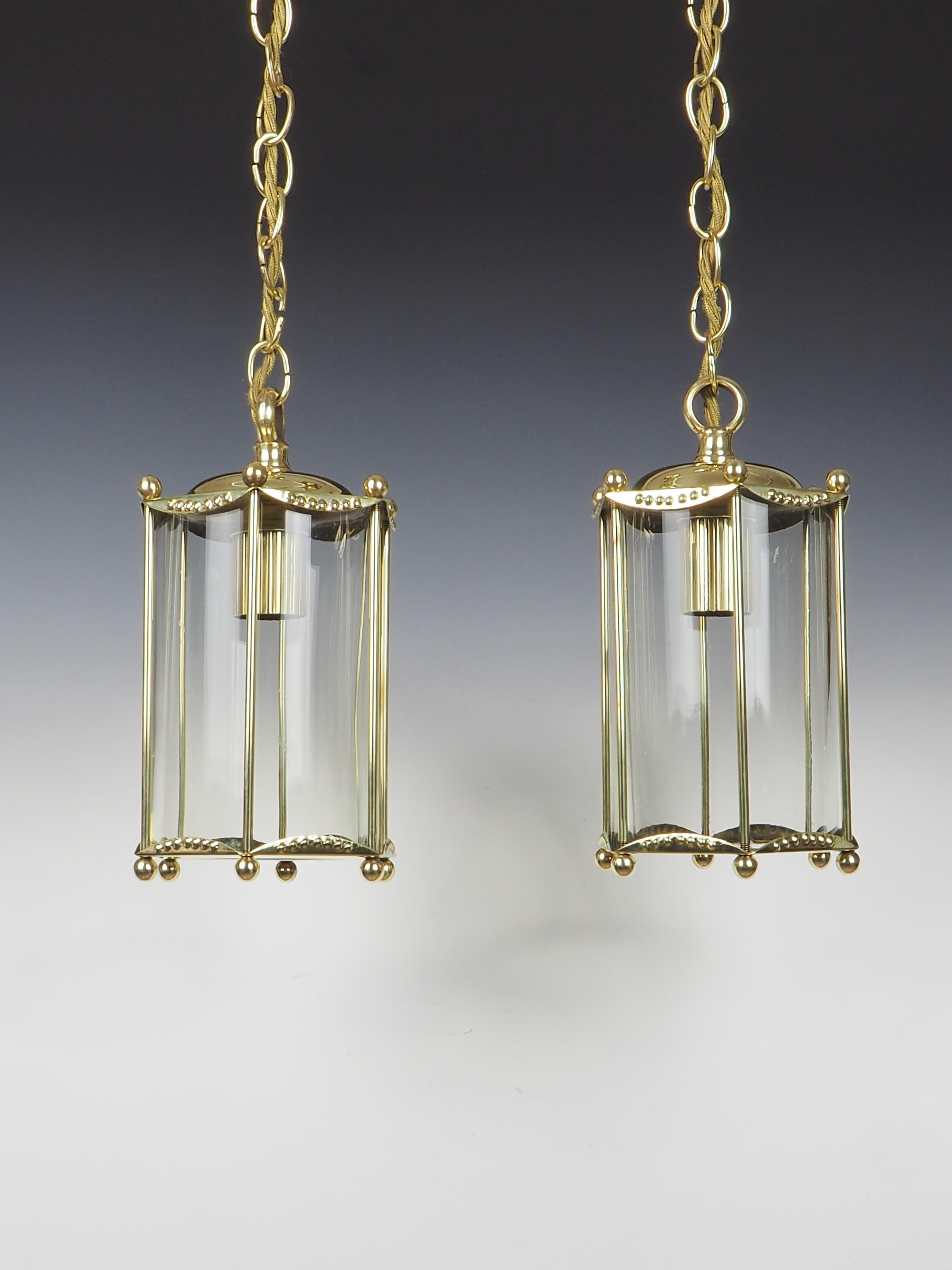 Antique pair of brass ceiling lanterns that effortlessly blend elegance with timeless charm.

These petite lanterns are meticulously crafted, showcasing a beautiful brass finish that exudes sophistication. The intricate detailing on the brass adds a
