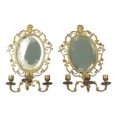 Ancienne paire de miroirs muraux en laiton