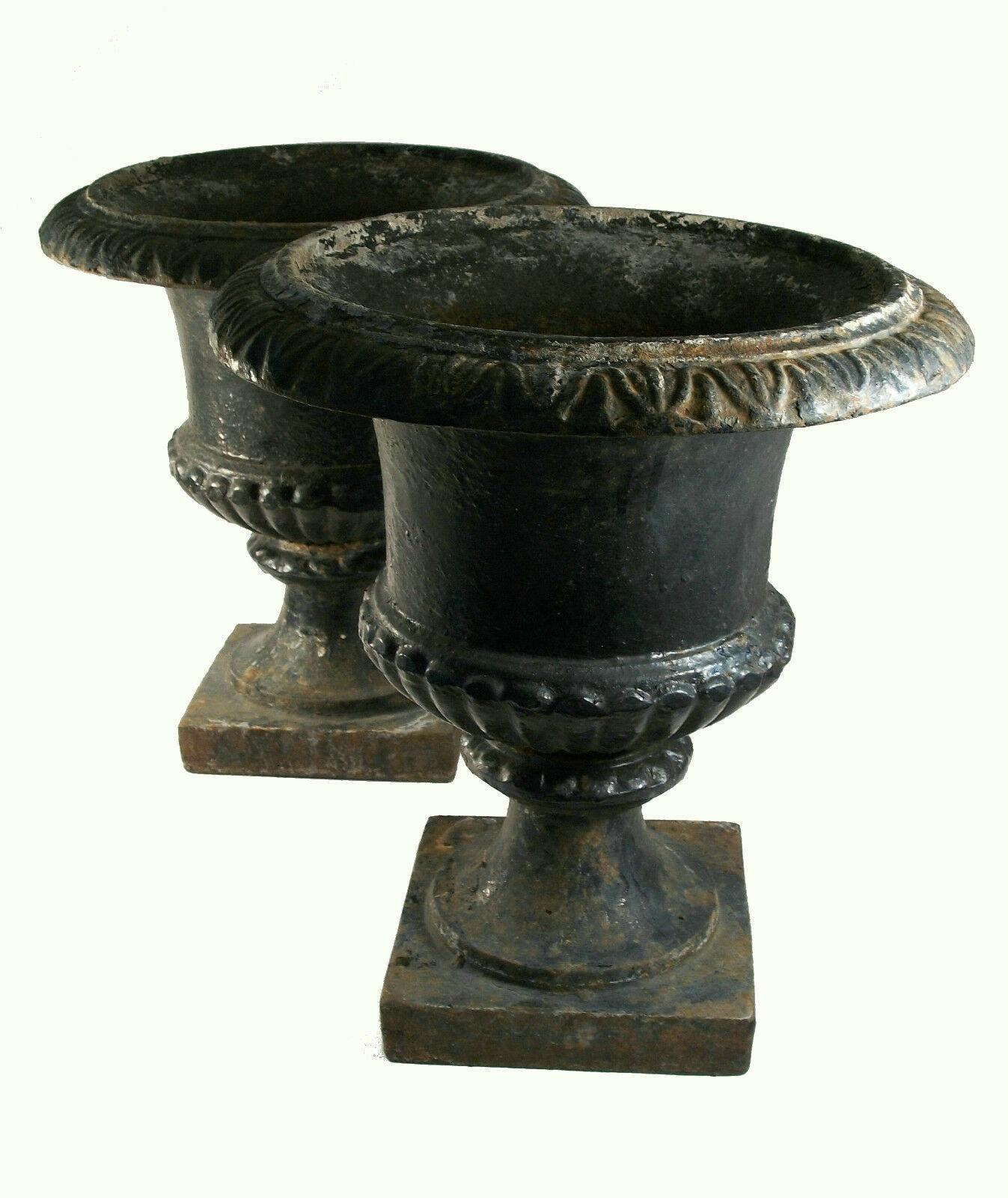 Antique pair of Campagna form cast iron garden urns - three separate cast pieces in each urn - unsigned - United States - late 19th century.

The over-all condition of this pair of pre-owned antique items is excellent - no loss - no damage - no