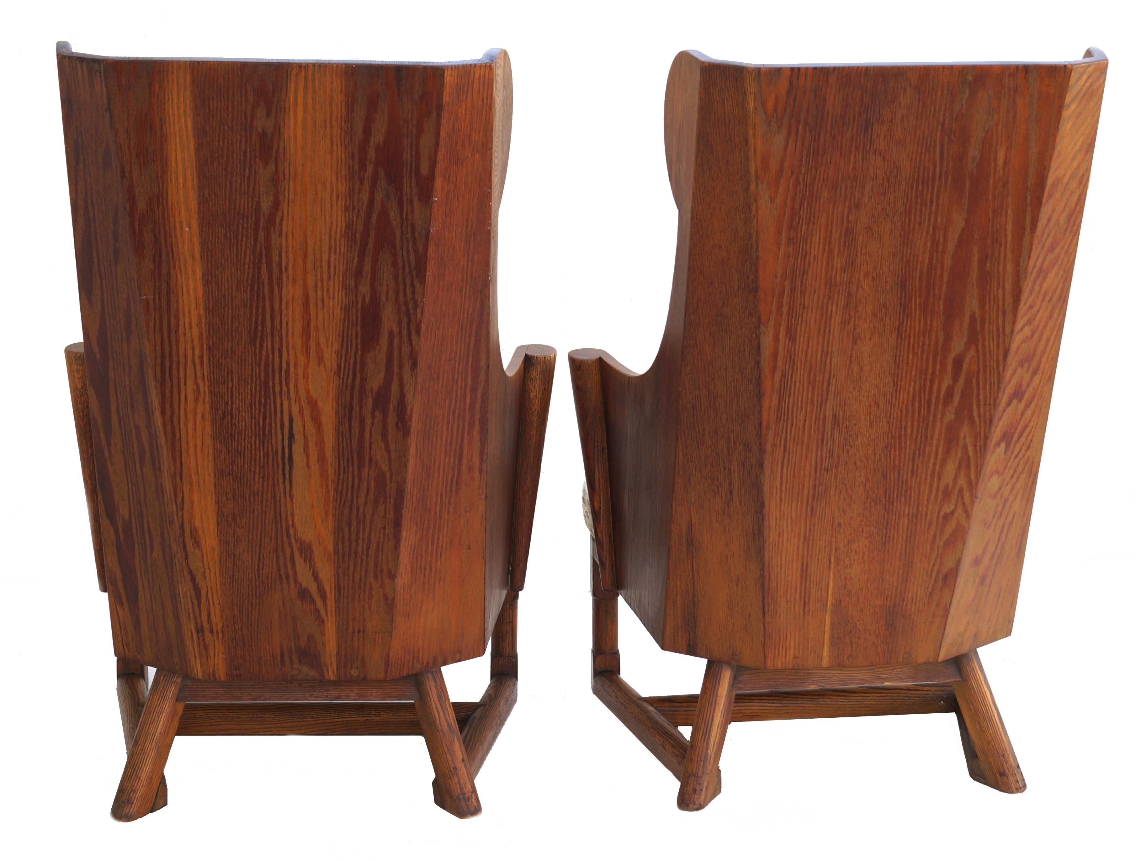 Mid-20th Century Antique Pair of Carved Oak Lounge Wingback Chairs Jamestown Lounge Co.