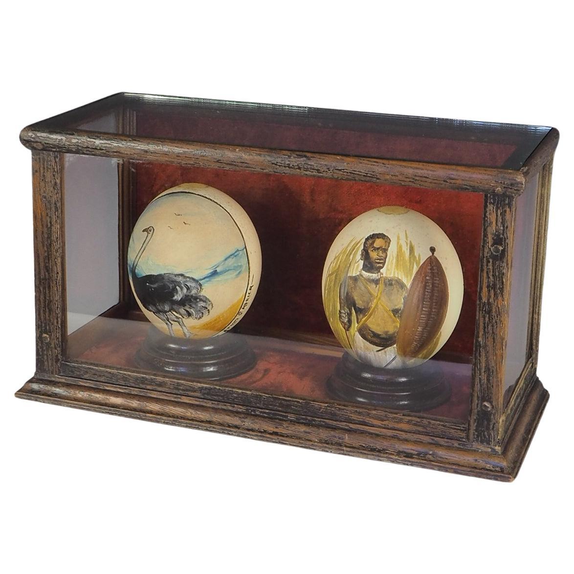 Antique Pair of Cased South African Ostrich Eggs Hand Painted For Sale
