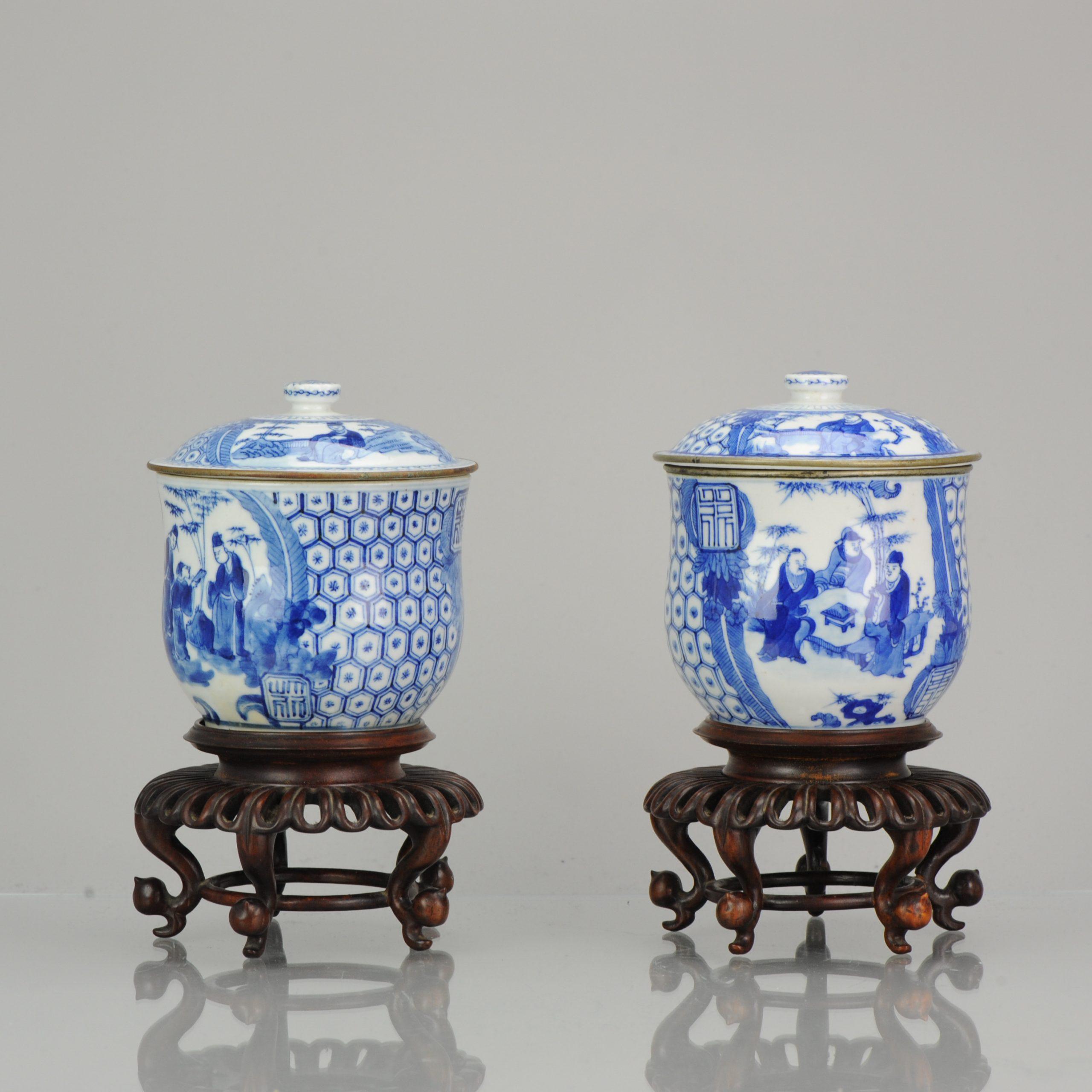 A top quality Bleu de Hue pair of lidded jars with figures and marks. China, 19th century. For the Vietnamese market

Marked:

Nei Fu, and can be translated as 