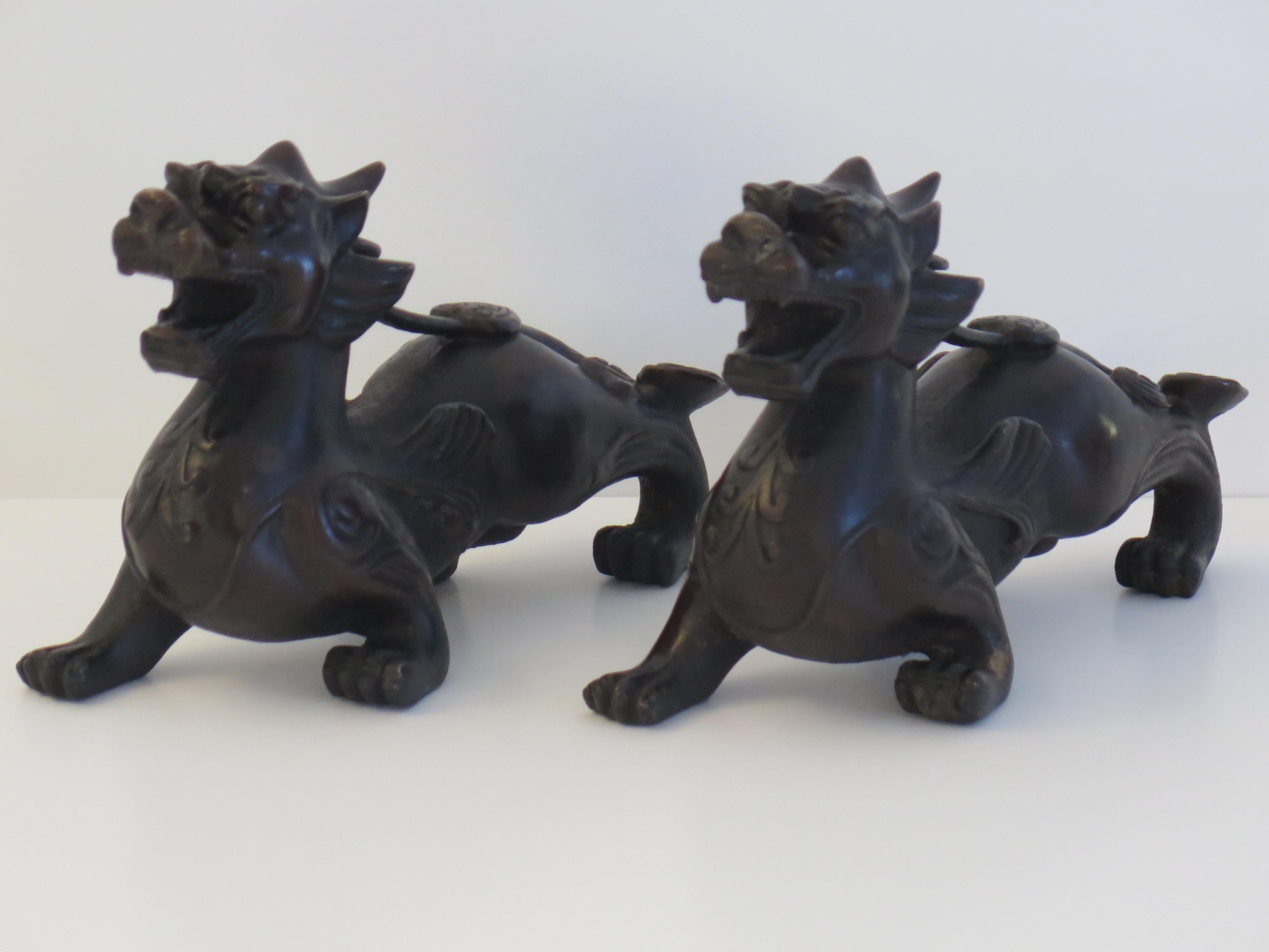 Cast Antique Pair of Chinese Bronze Foo Dogs Good Detail, Qing Dynasty For Sale