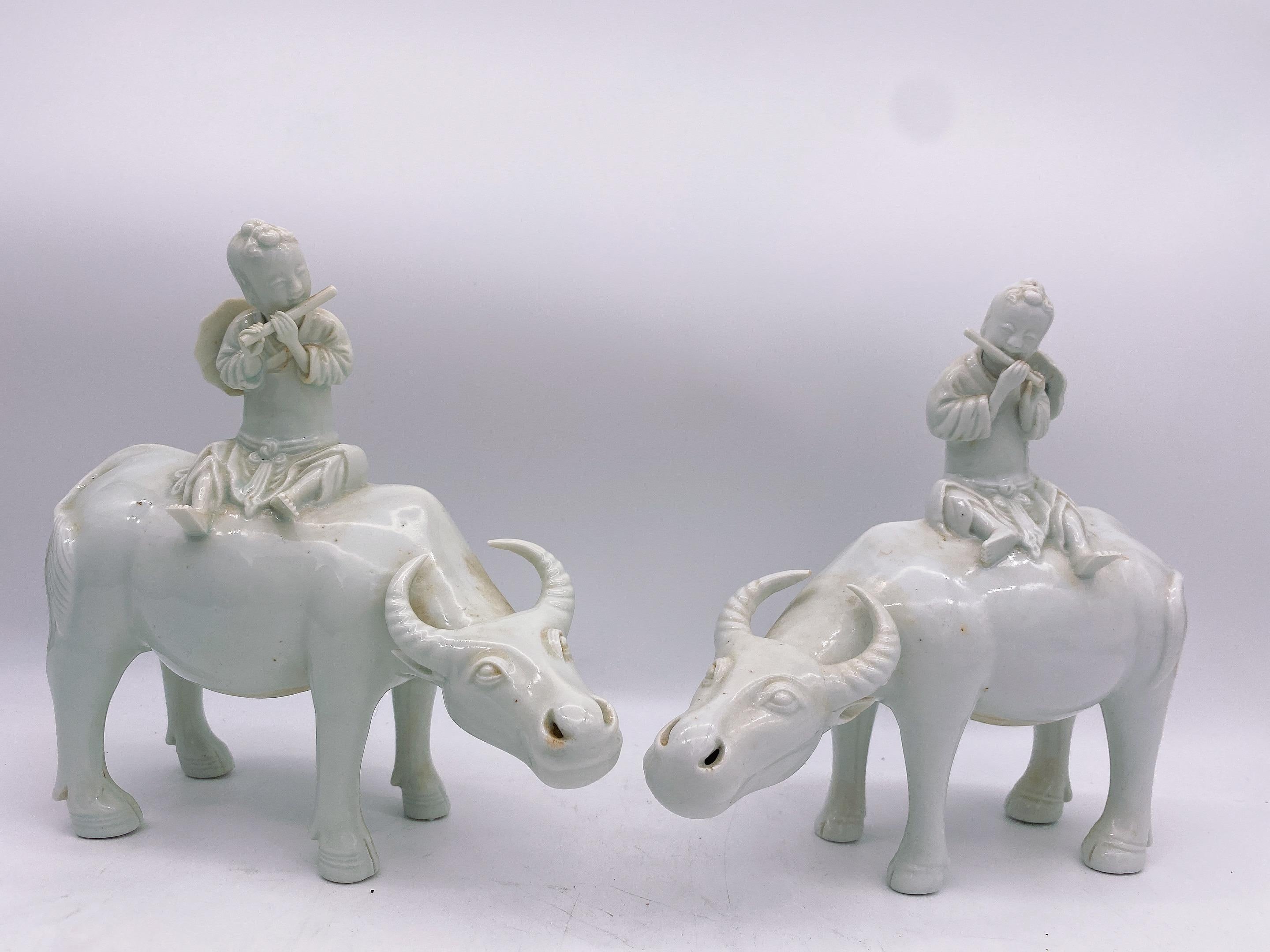 A pair of antique Chinese measures: 8” x 8'' dehua porcelain figures of boys on water buffalos, republic period, 3'' see more pictures. buy from Bonhams of Los Angeles.