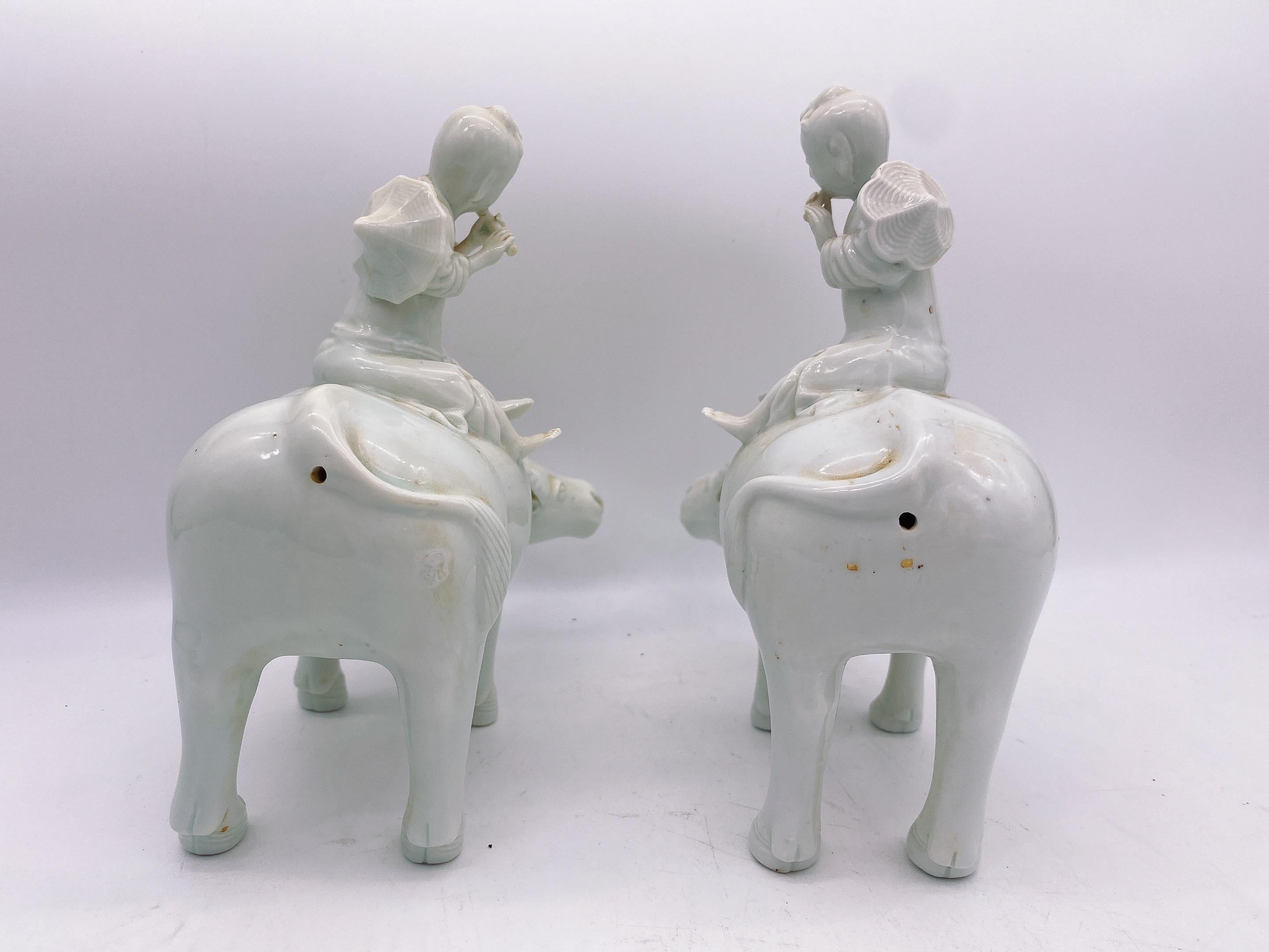 Chinese Export Antique Pair of Chinese Dehua Porcelain Figures of Boys on Water Buffalos For Sale