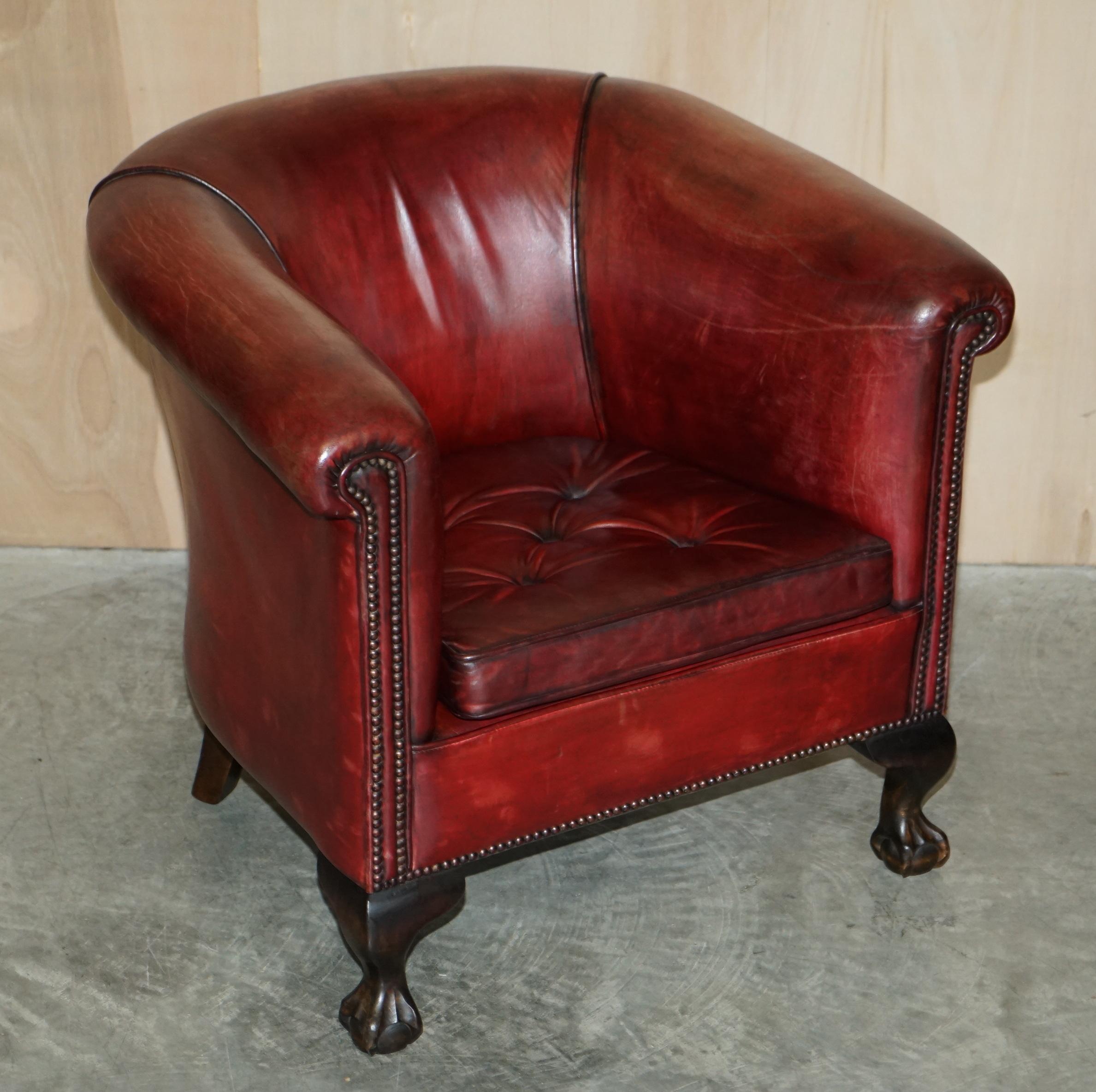 We are delighted to offer for sale this stunning pair of vintage circa 1900 hand made in England tub armchairs with carved Claw & Ball feet and Chippendale floating button cushions

A good looking, well made and decorative pair, they are also