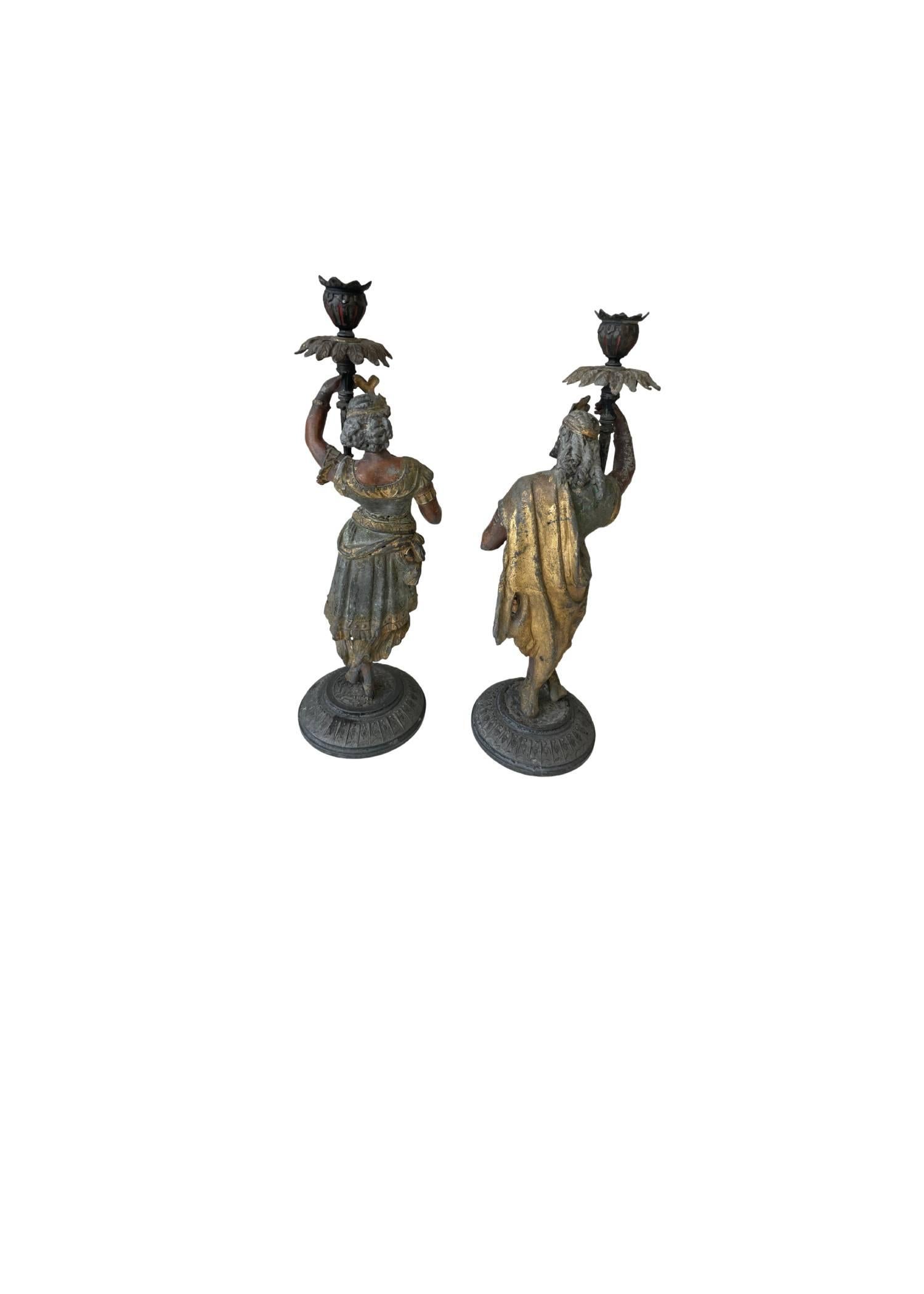 Indian Antique Pair of Cold Painted Regal Man & Woman White Meta Figural Candlesticks For Sale