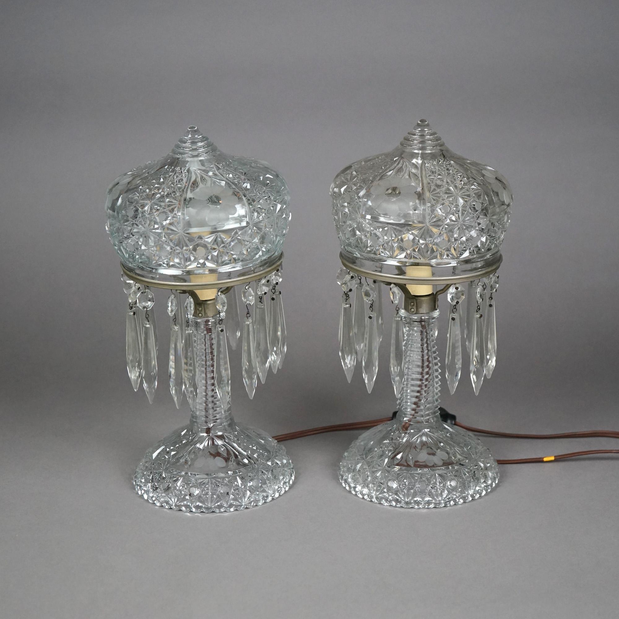 An antique pair of table lamps offer cut glass shades and bases with prism highlights, electrified, c1930

Measures- 12.75''H x 6''W x 6''D
