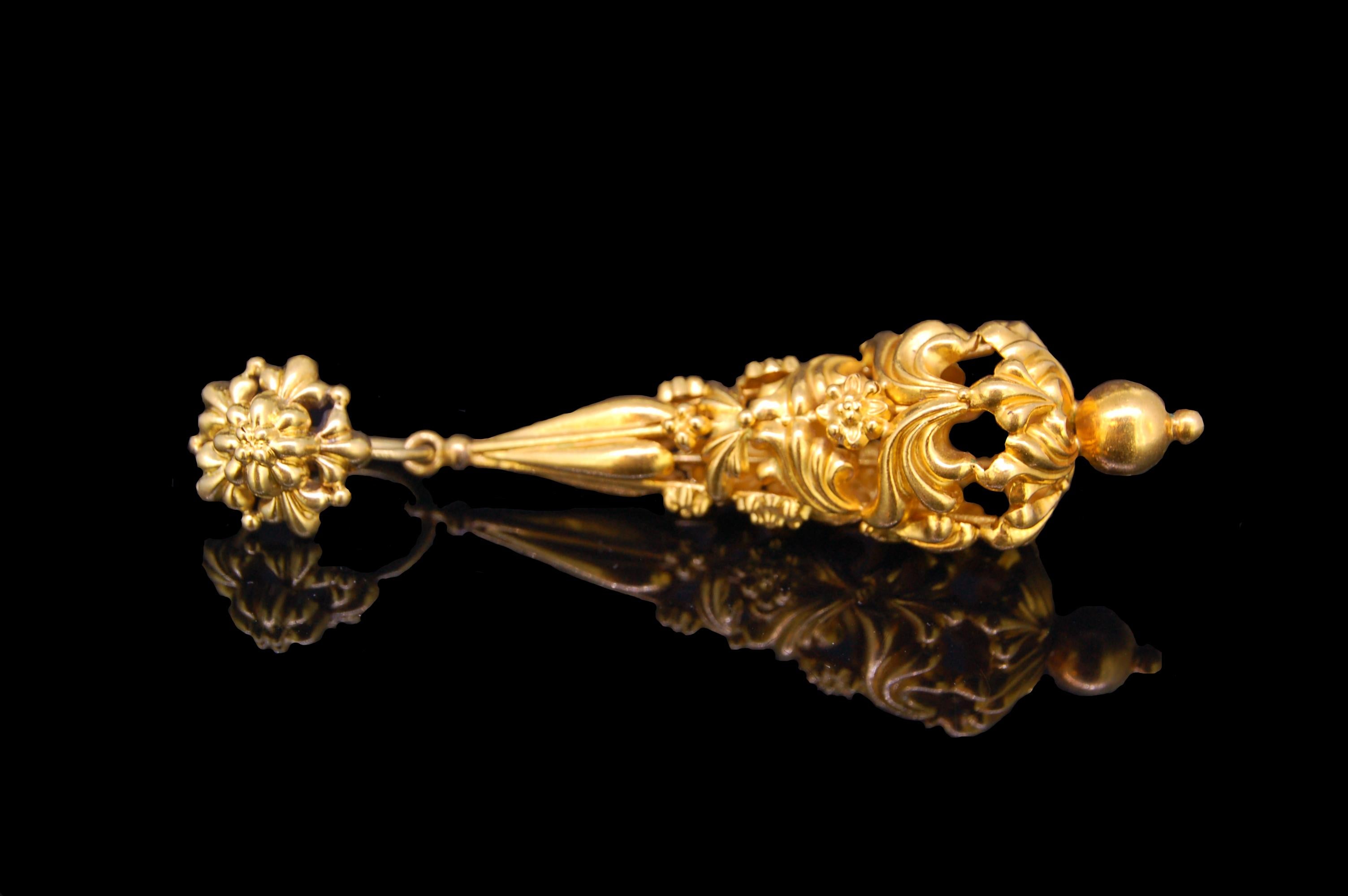 ANTIQUE PAIR OF DROP EARRINGS, yellow precious metal, the bottom of the drop with openwork floral motifs, suspending from a stylized flowerhead top. L. 7.6 cm. 13 grams.