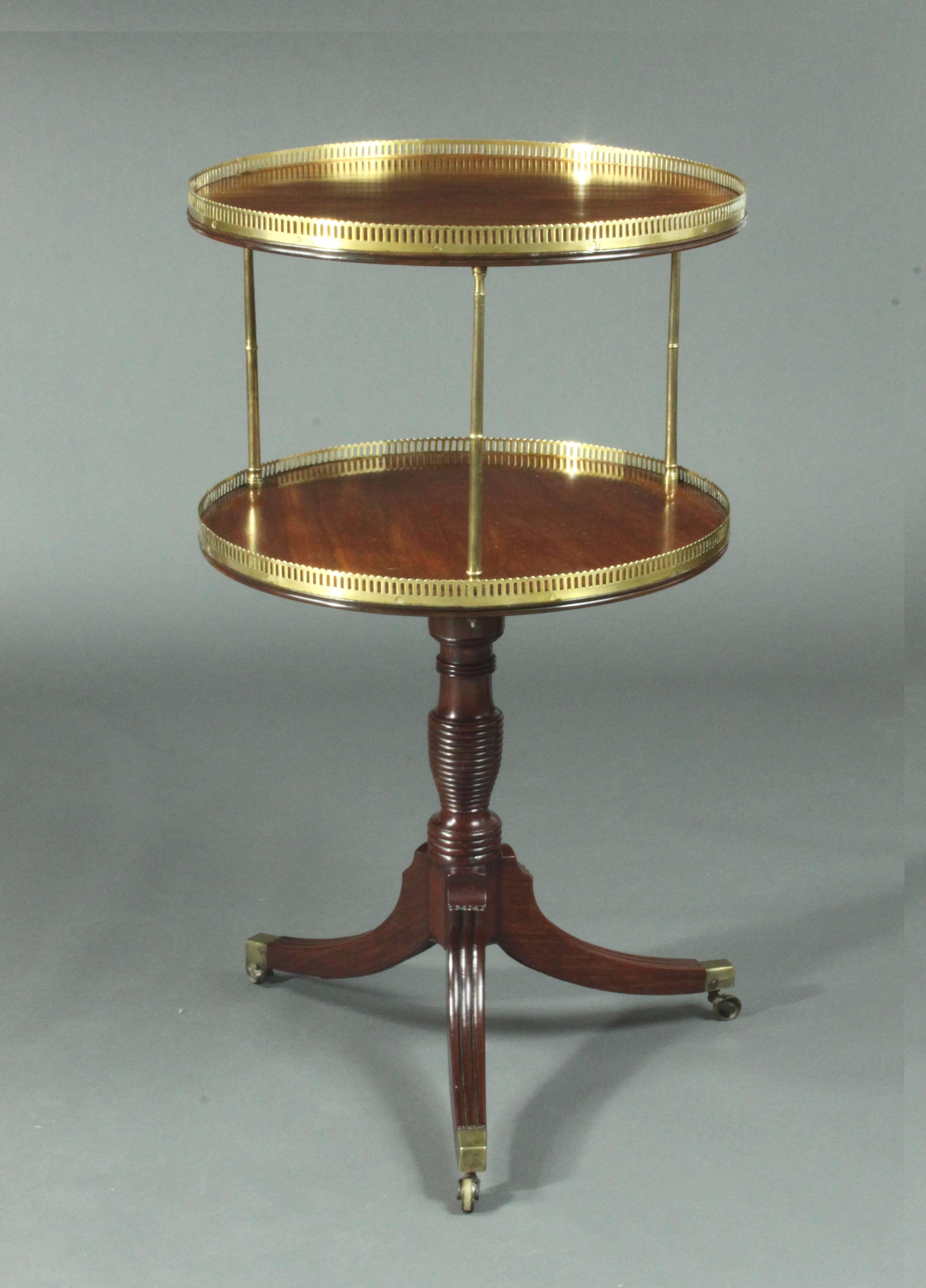 A fine pair of two-tier Regency mahogany dumb waiters with brass pillars and galleries.
   
    