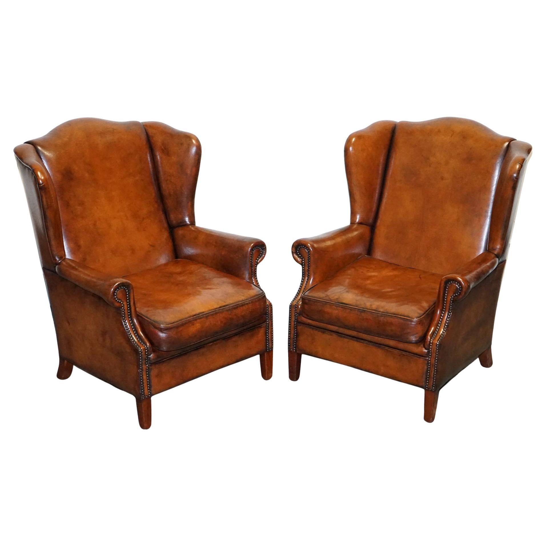 ANTIQUE PAIR OF DUTCH HAND DYED BROWN CATTLE LEATHER WINGBACK ARMCHAiRS