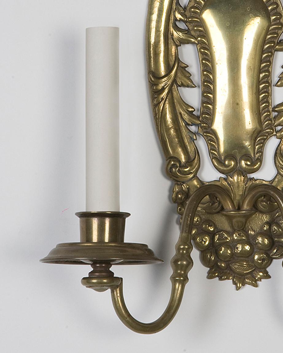 Neoclassical Two Arm Brass E. F. Caldwell Sconces with a Fruit and Foliate Motif, Circa 1910s For Sale