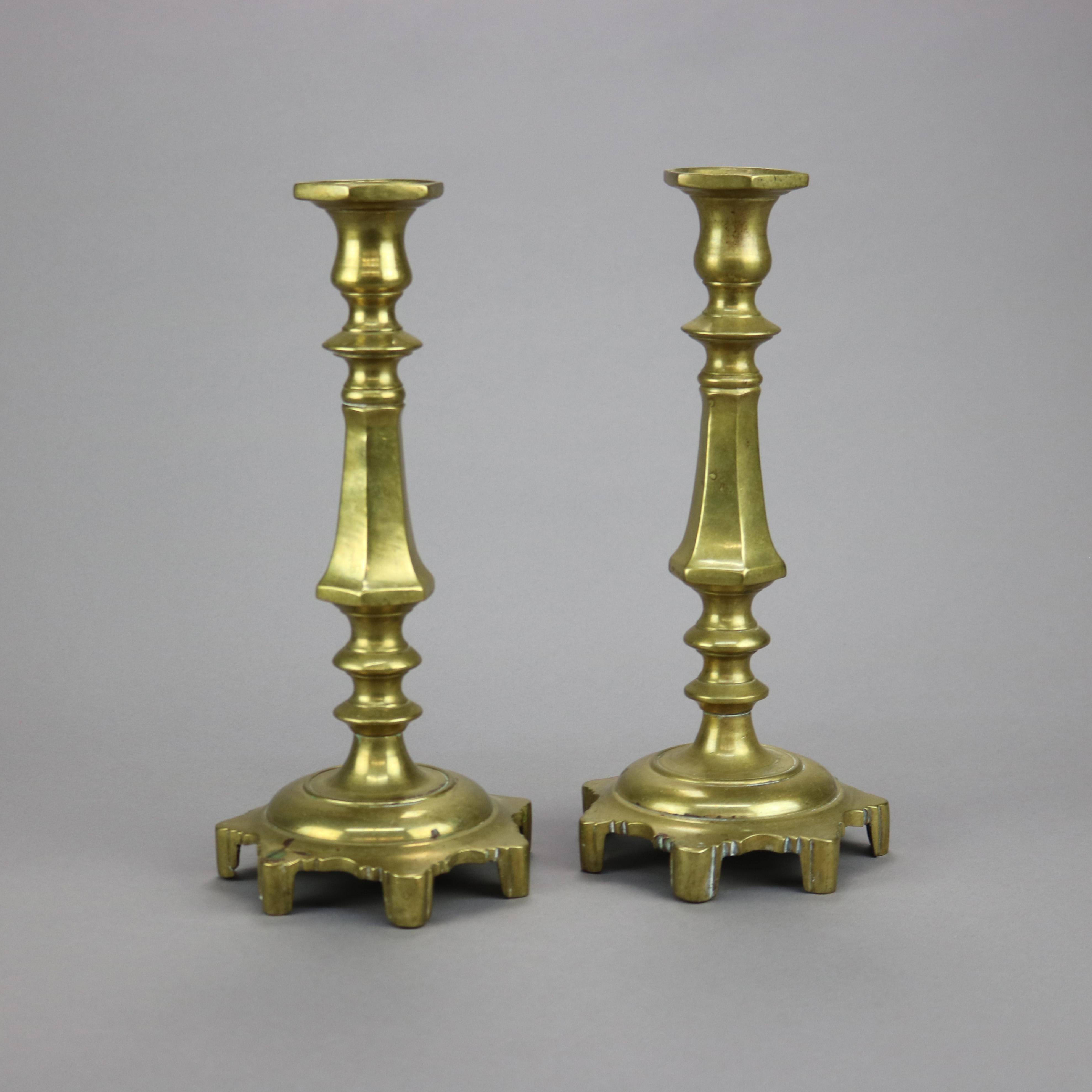 An antique pari of early American candlesticks offers cast brass construction in balustrade form raised on footed base, 19th century

Measures - 11.25''H x 5''W x 5''D.

Catalogue Note: Ask about DISCOUNTED DELIVERY RATES available to most regions