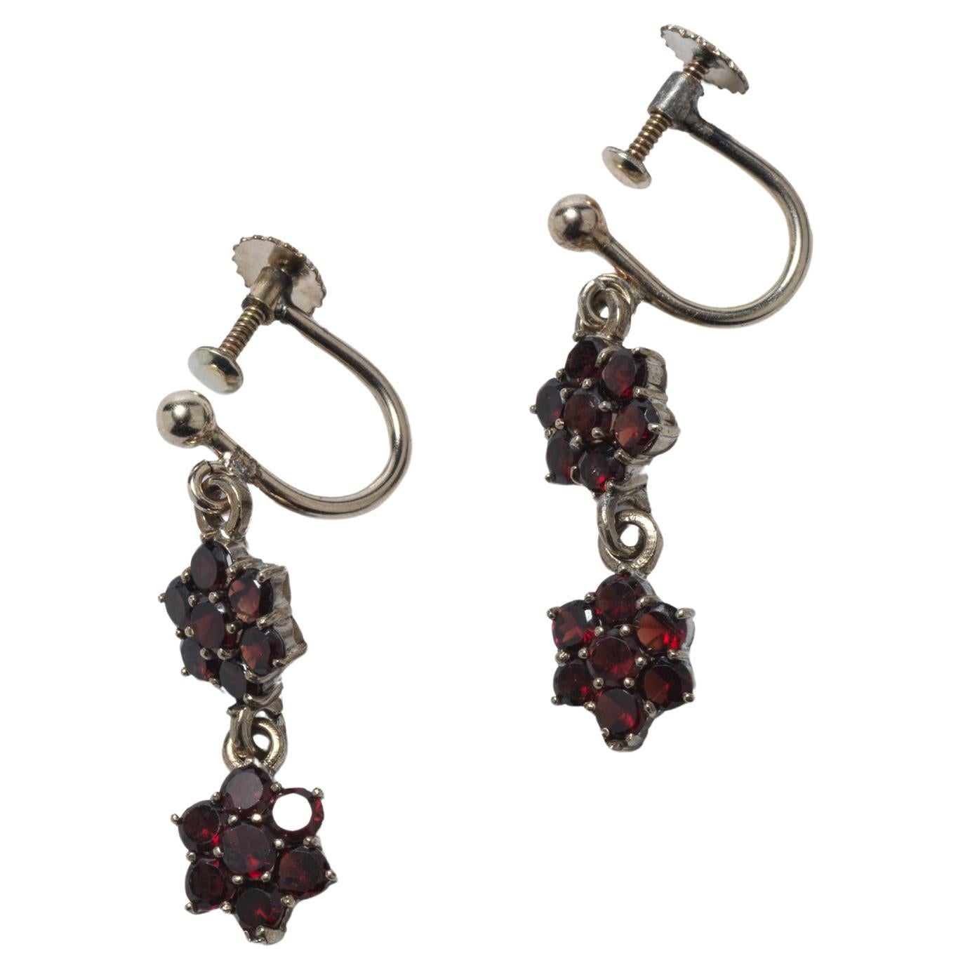 Antique pair of earrings. Silver and garnets. For Sale